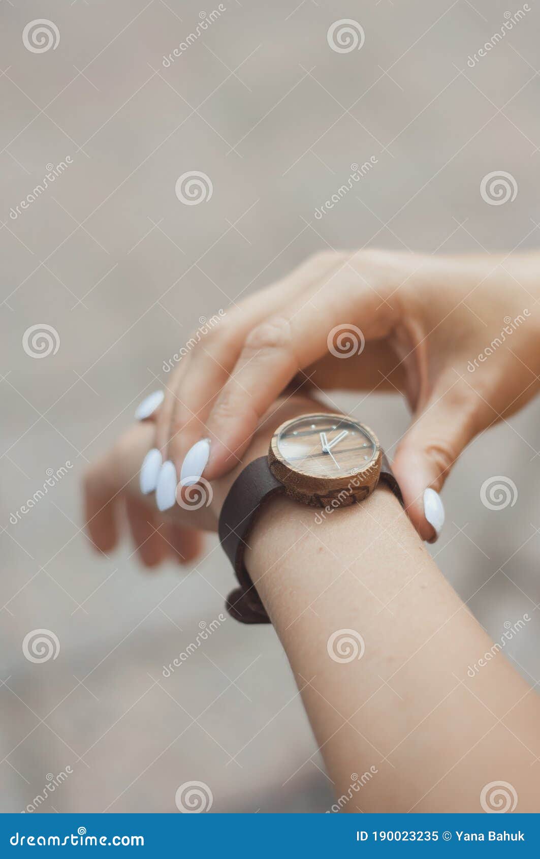 woman looking at her watch