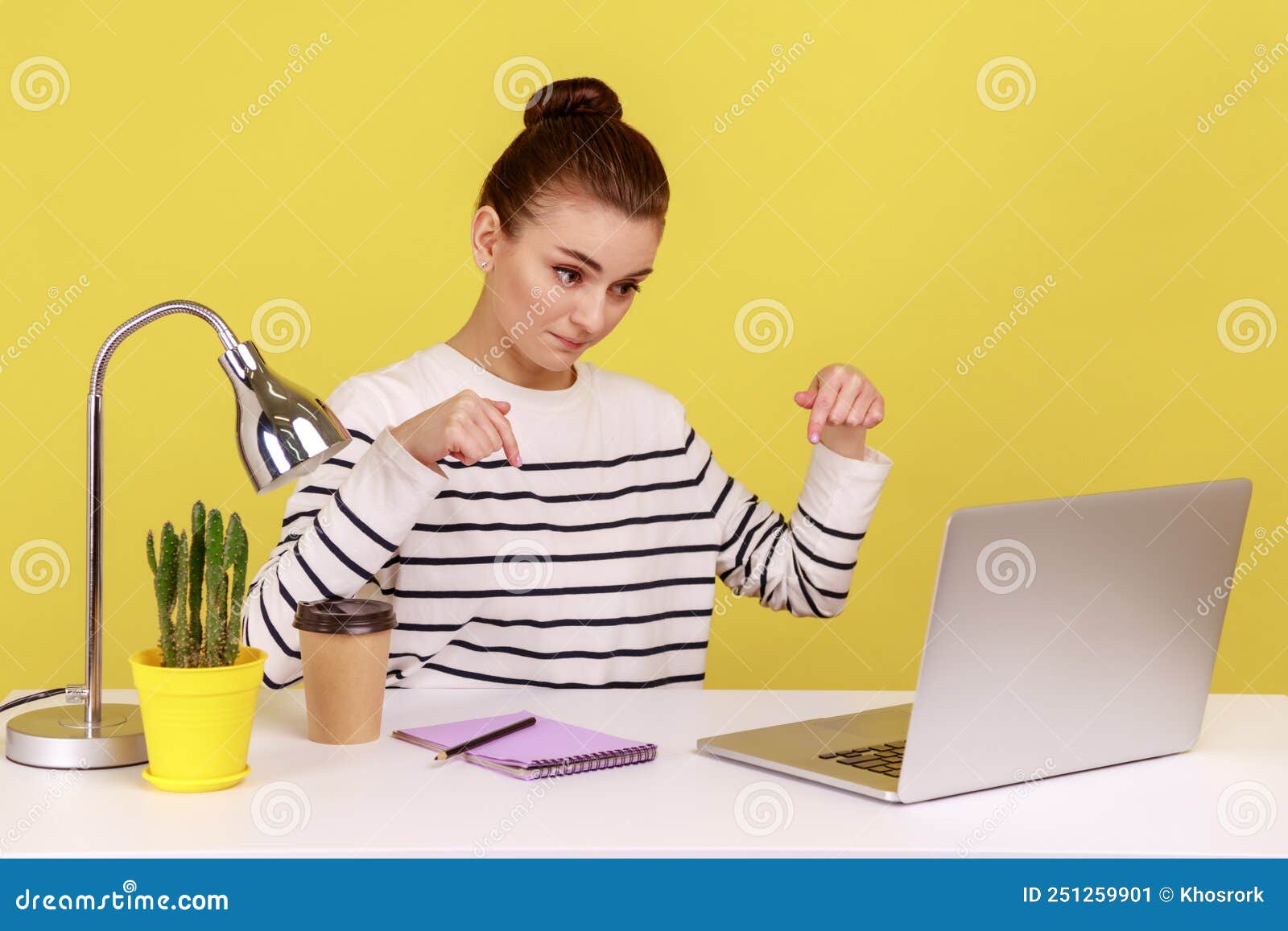 Woman Looking at Laptop Display, Pointing Down, Controlling and ...