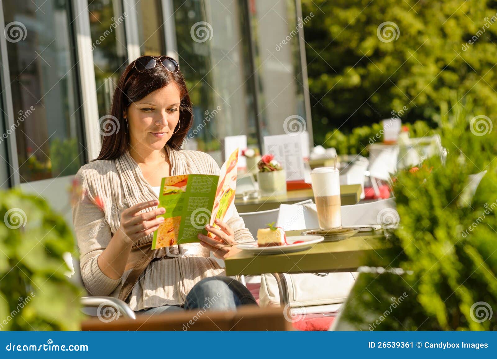 woman looking at menu cafe bar terrace