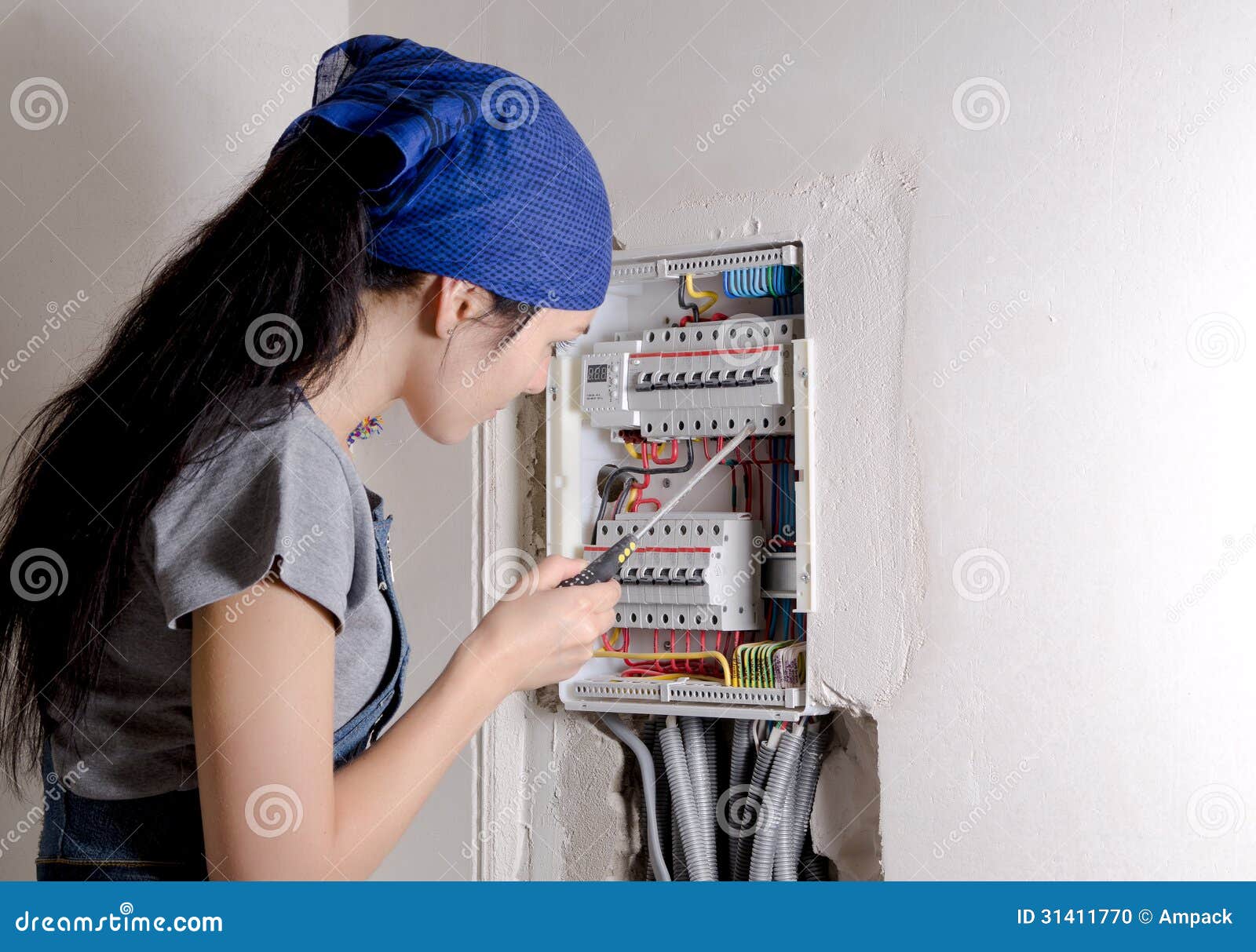 Woman Looking at an Open Electrical Stock Photo Image of household