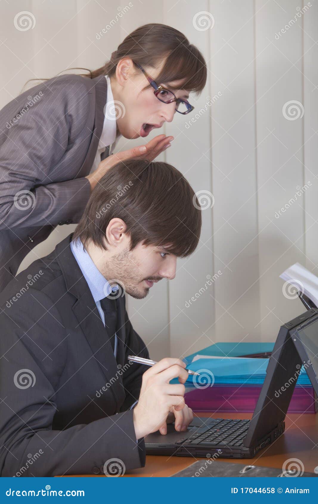 Woman Looking Over Man Shoulder At Computer Royalty Free Stock Photos