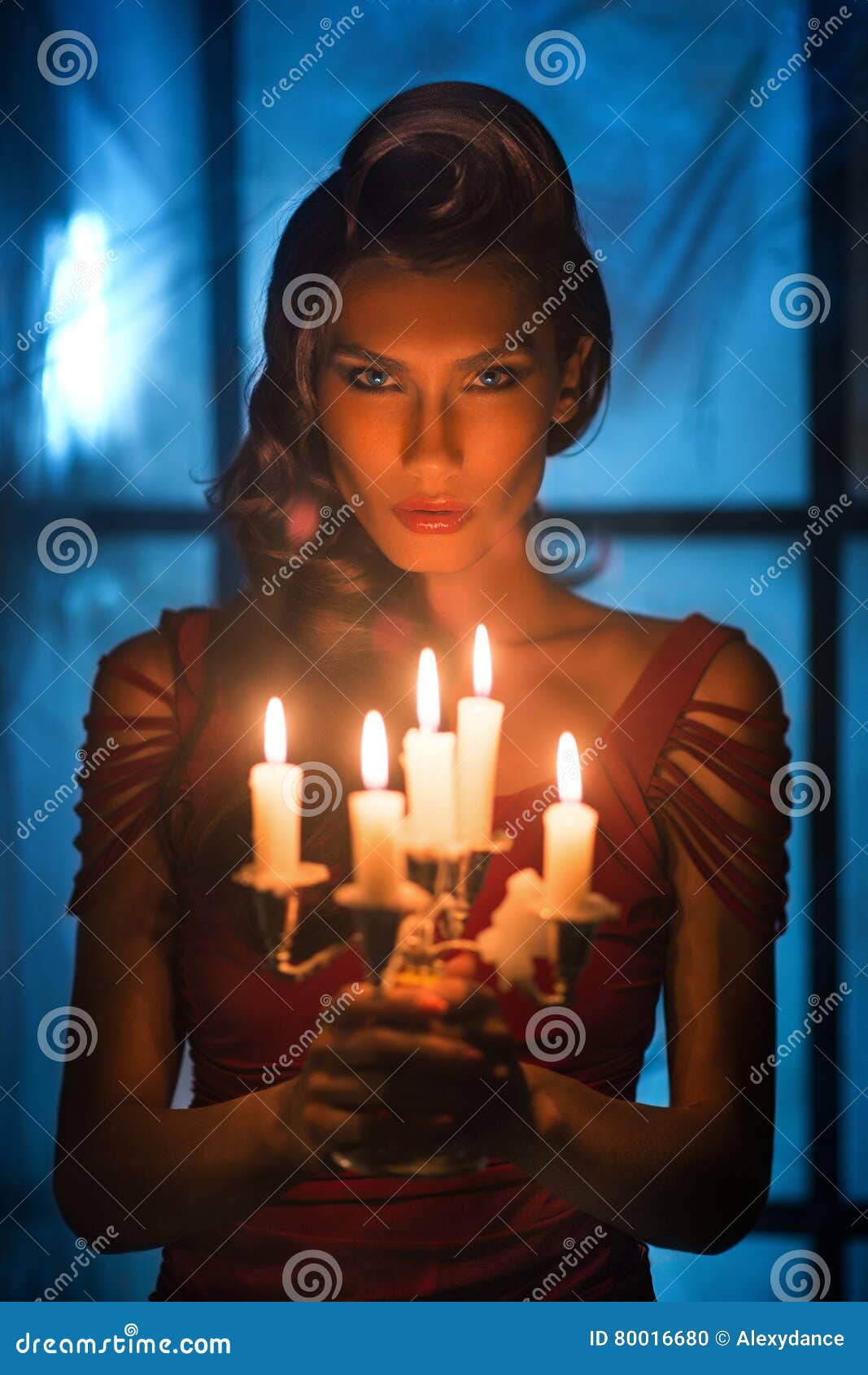 Woman Looking On Red Candles In The Fabulous Night Stock Photo Image