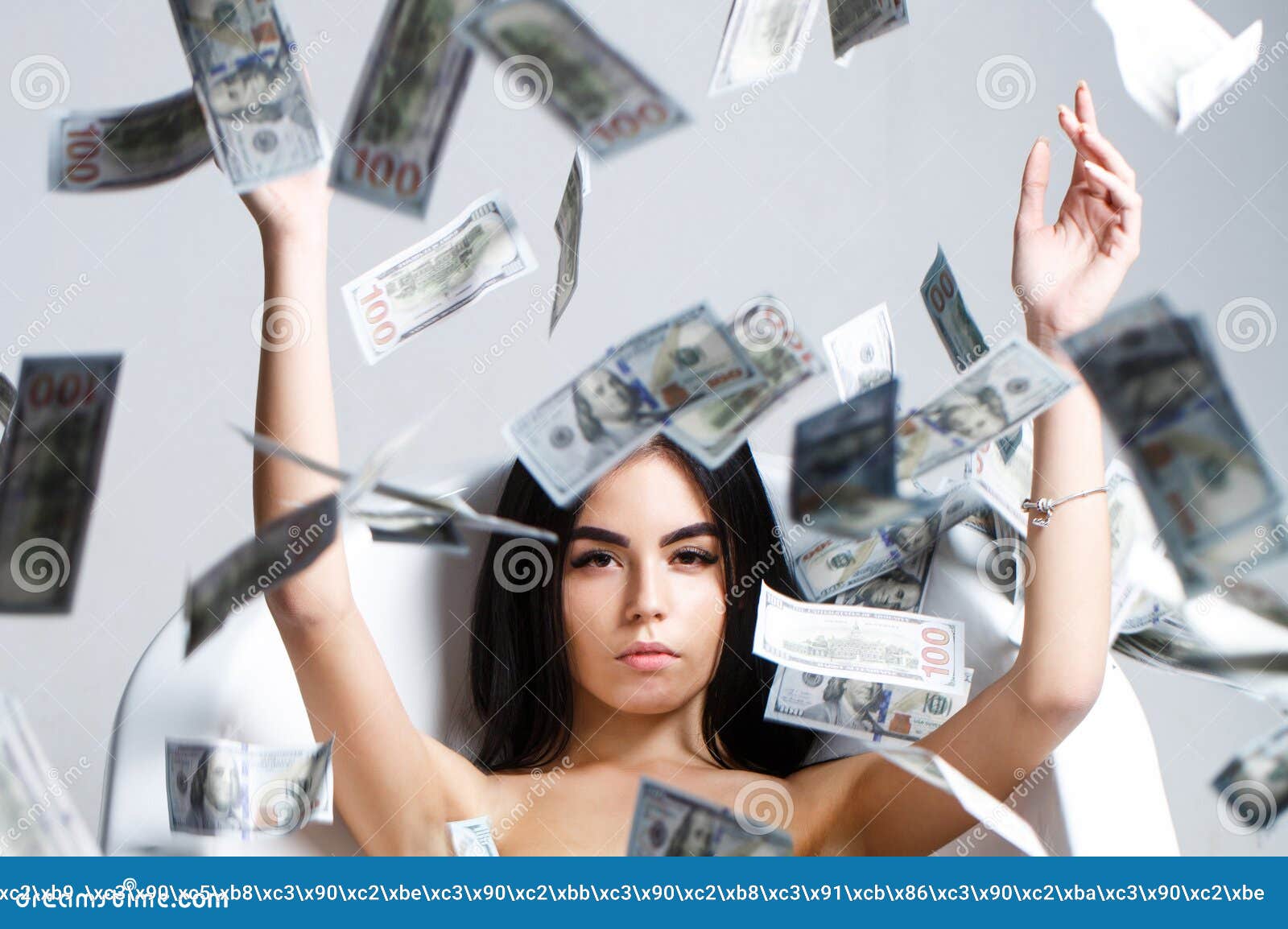 woman with lot of money. millionaire woman lying in bedroom. sexy woman lying in dollar bills. rich sexy woman lies on