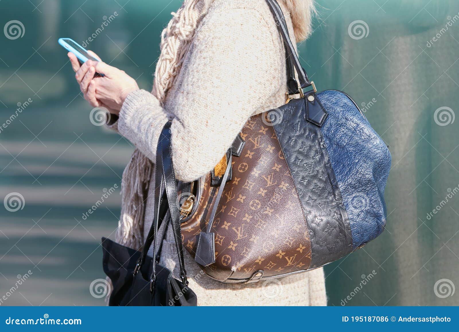 Woman with Louis Vuitton Bag in Brown and Blue Colors before Giorgio Armani  Fashion Show, Milan Fashion Week Editorial Photo - Image of beige, outfit:  195187086