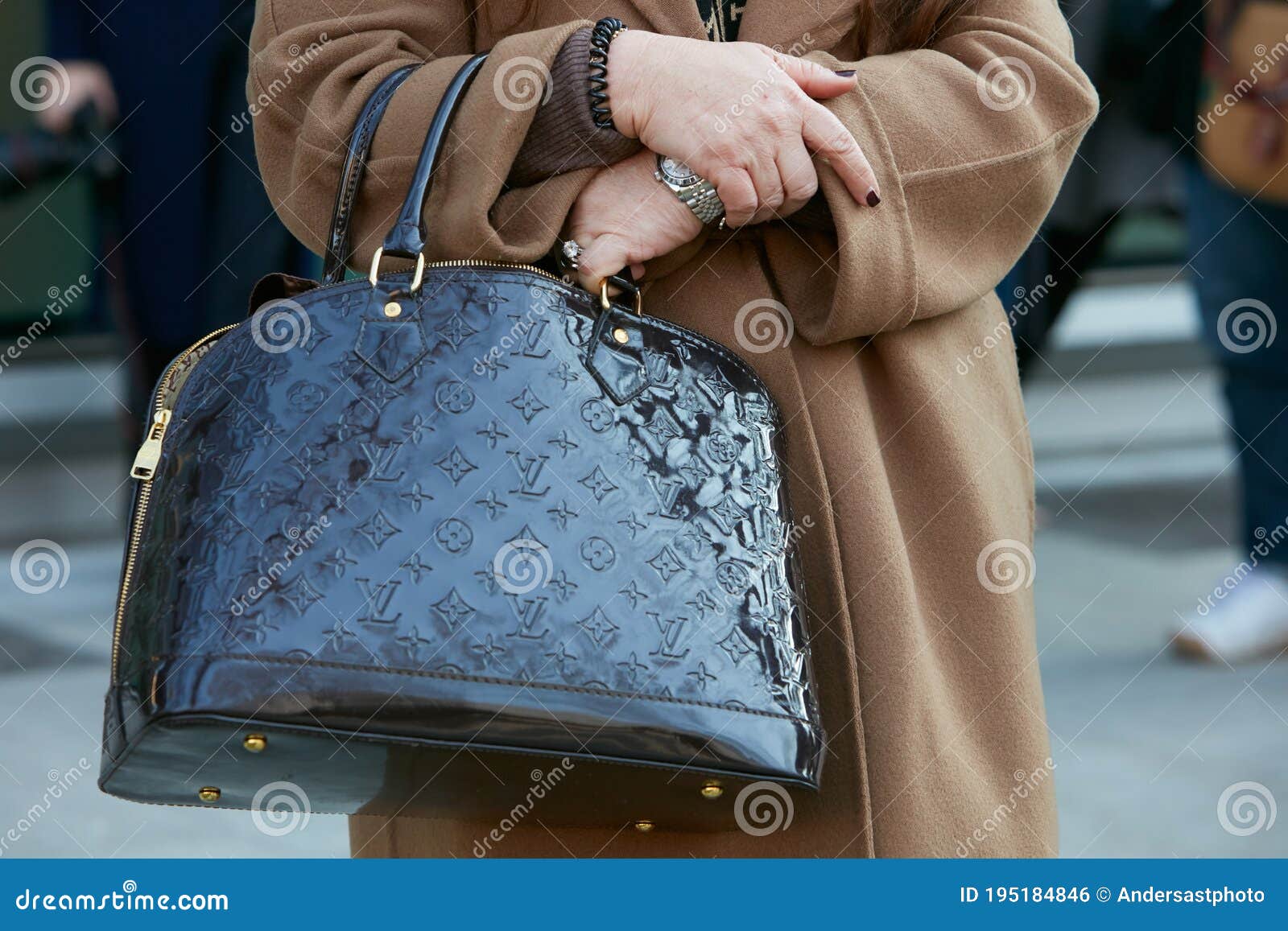 Woman with Louis Vuitton Black Patent Leather Bag before Giorgio Armani  Fashion Show, Milan Fashion Week Editorial Photo - Image of february,  outdoor: 195184846