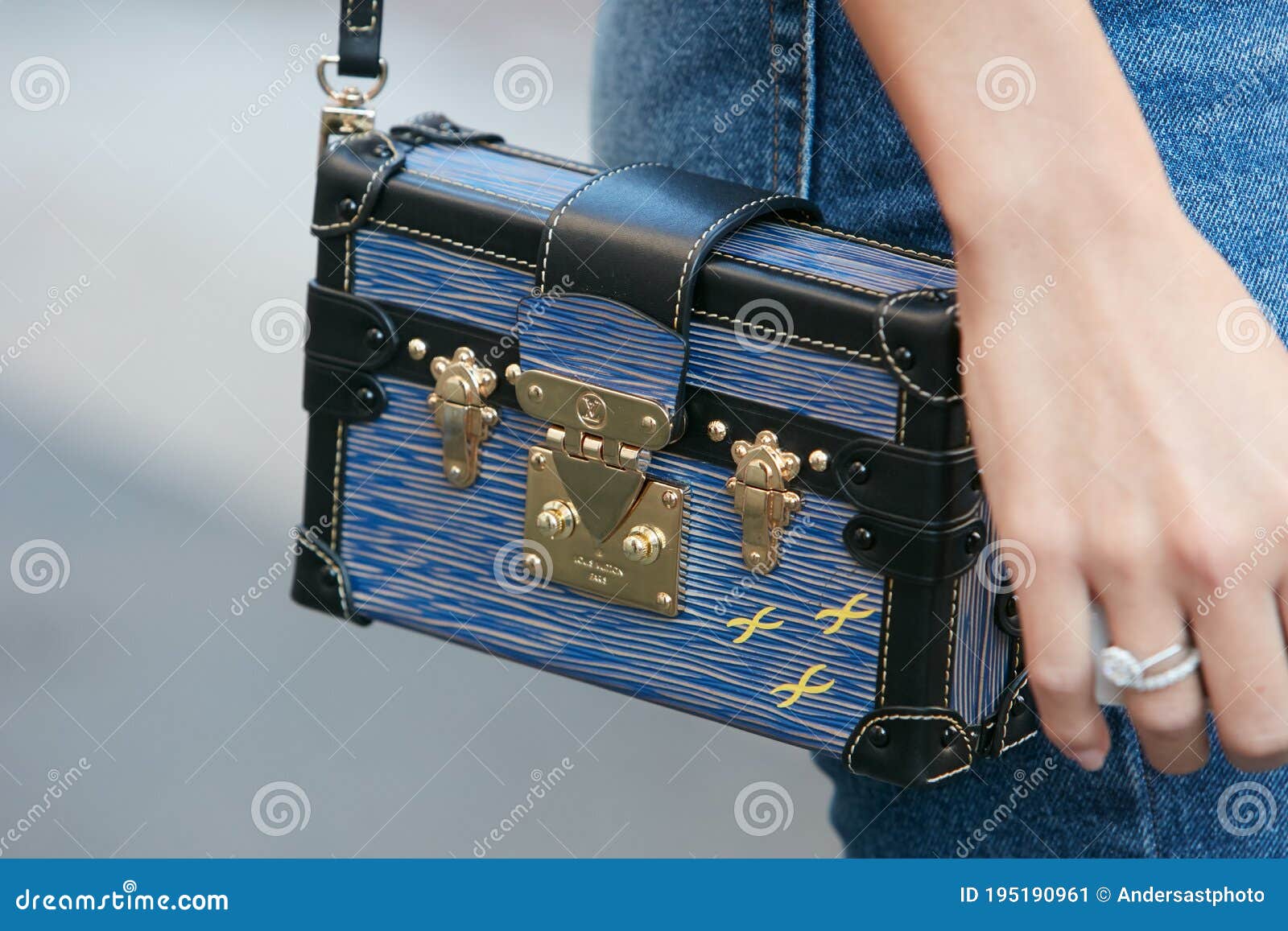 Woman with pink Louis Vuitton leather bag and blue floral trousers before  Salvatore Ferragamo fashion show, Milan Fashion Week, 2017 Stock Photo -  Alamy