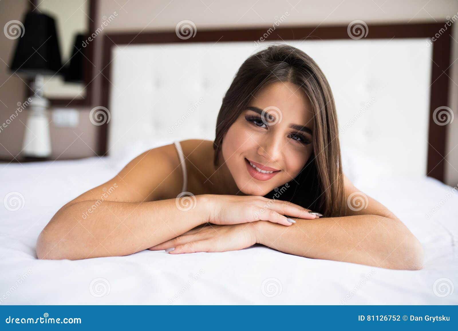 Woman lying on her bed stock photo. Image of bedroom 81126752