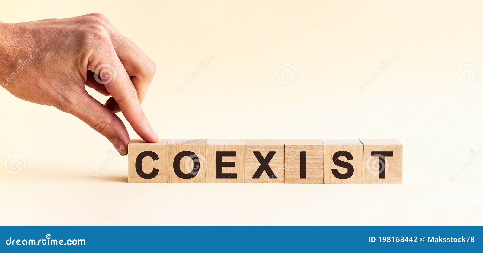 woman made word coexist with wood blocks