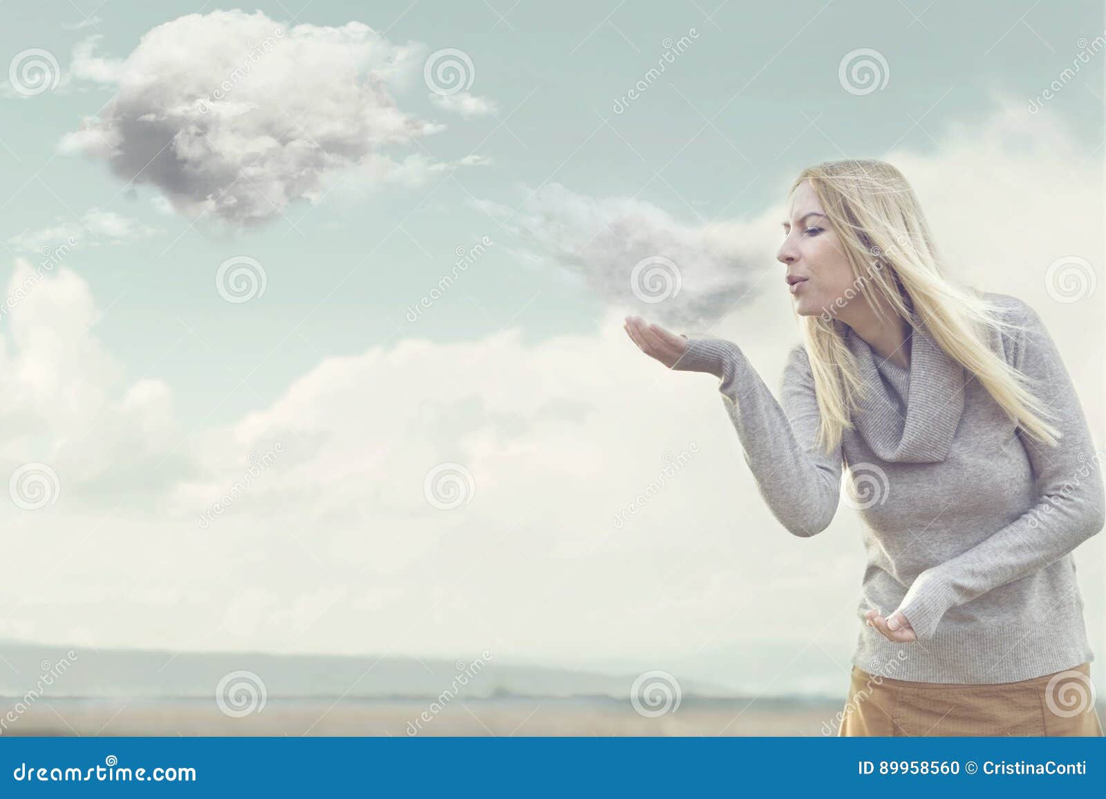 woman with magical powers creating clouds