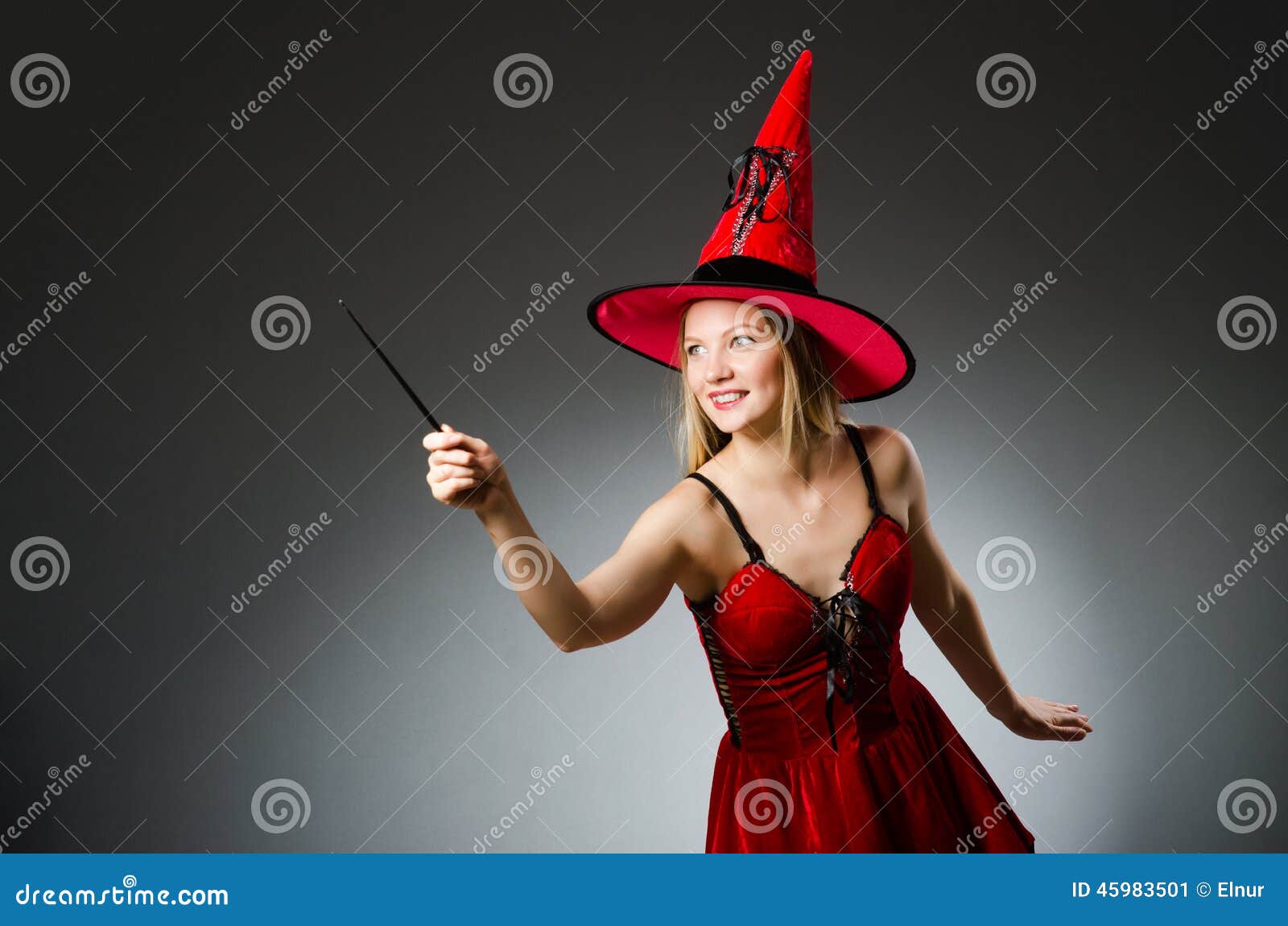 Woman magician doing her tricks with wand