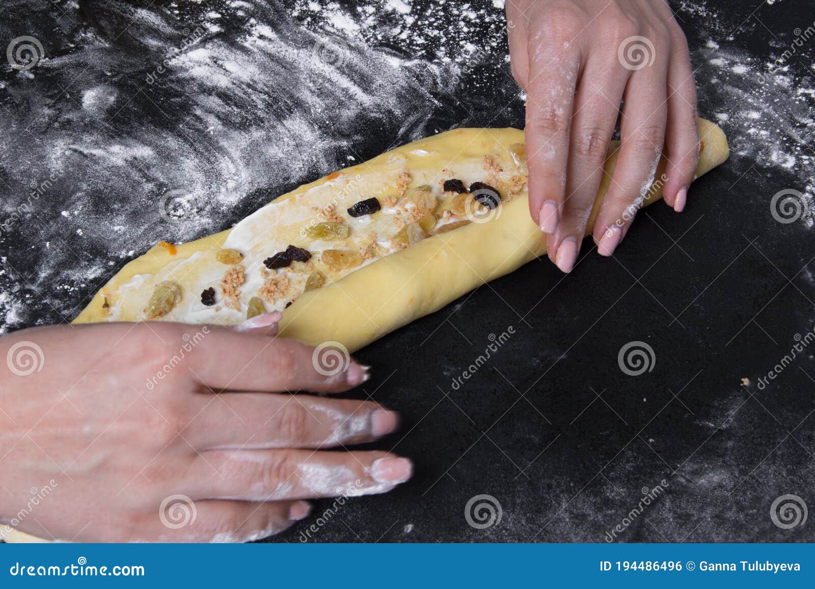 woman make dough for sweet homemade backery on black background