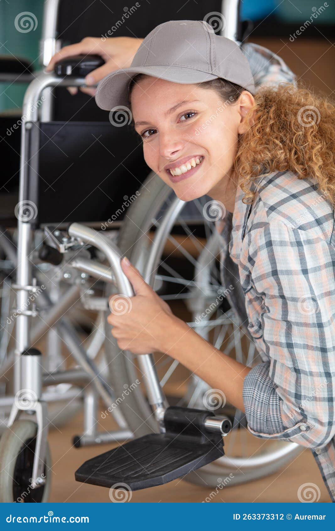 Woman Making Adjustment on Wheelchair Stock Photo Image of adjust