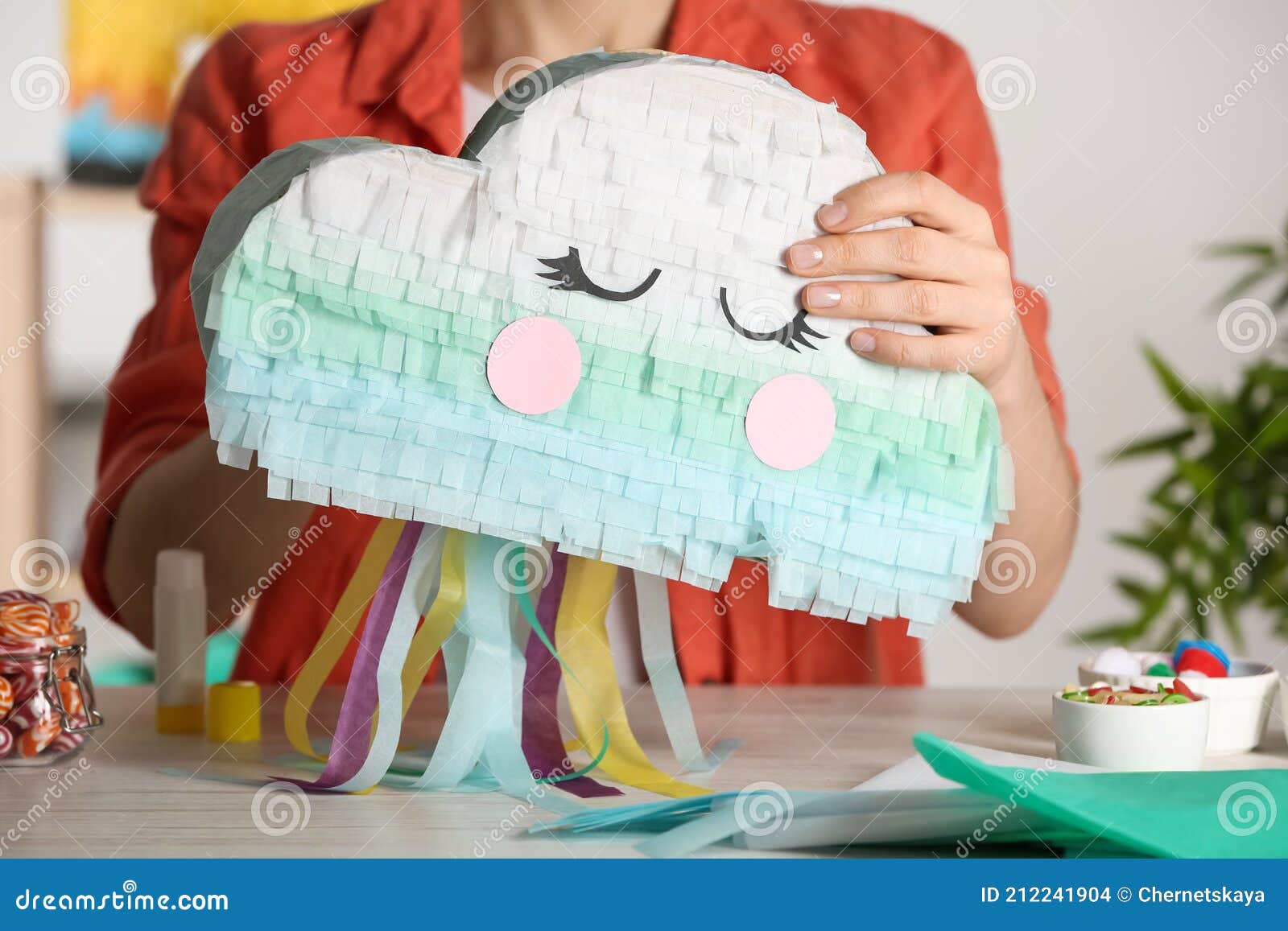 Woman Making Cardboard Cloud at White Wooden Table, Closeup