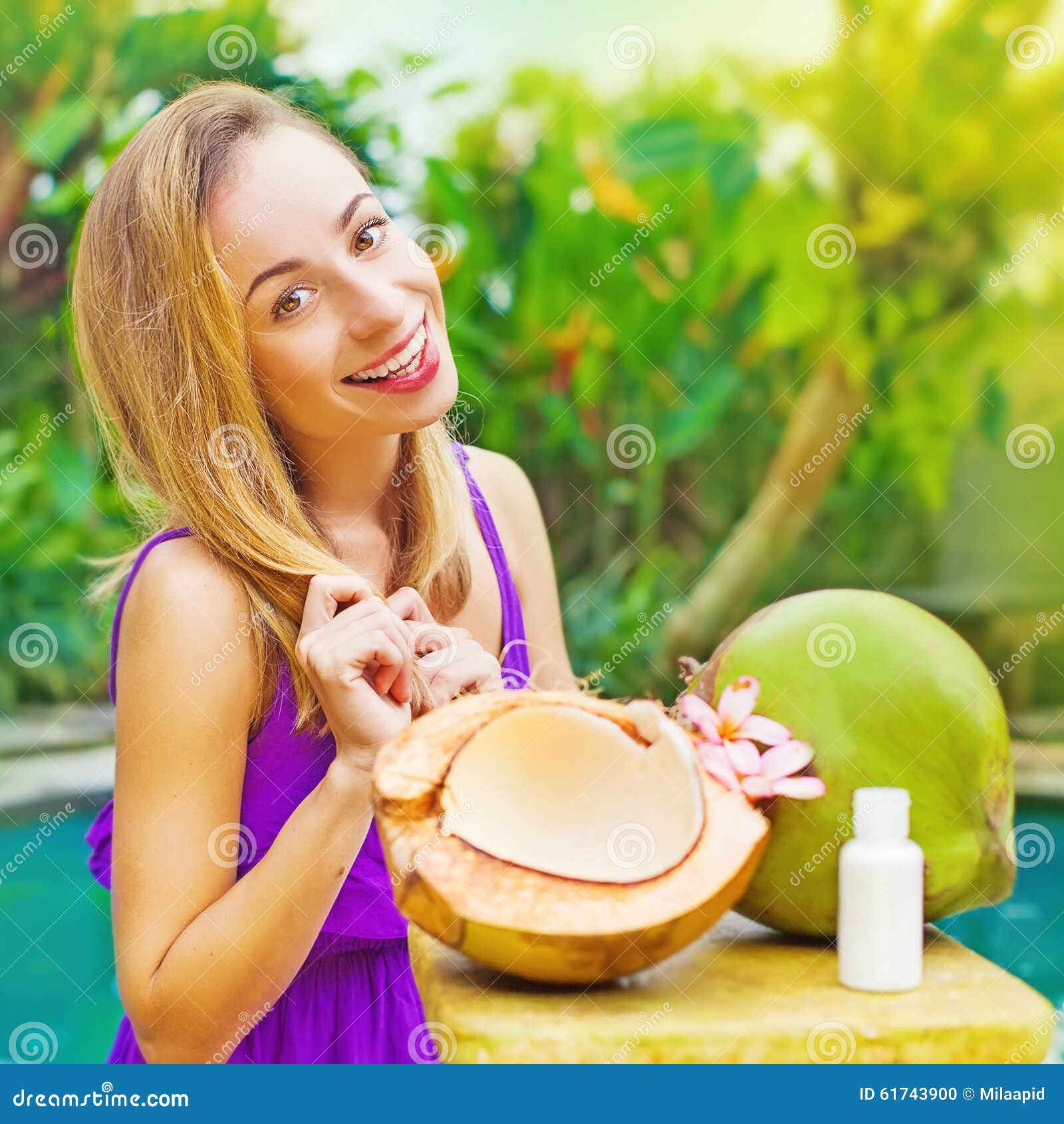 Woman making a coconut oil stock photo. Image of beauty 61743900