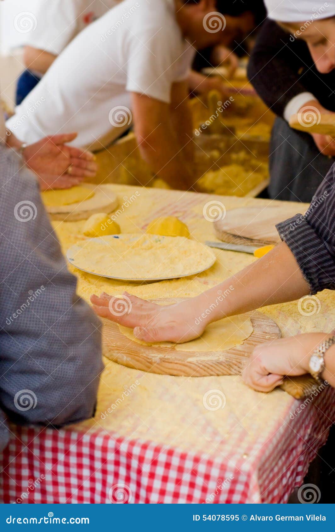 woman making talos, tortilla than wraps txistorra.