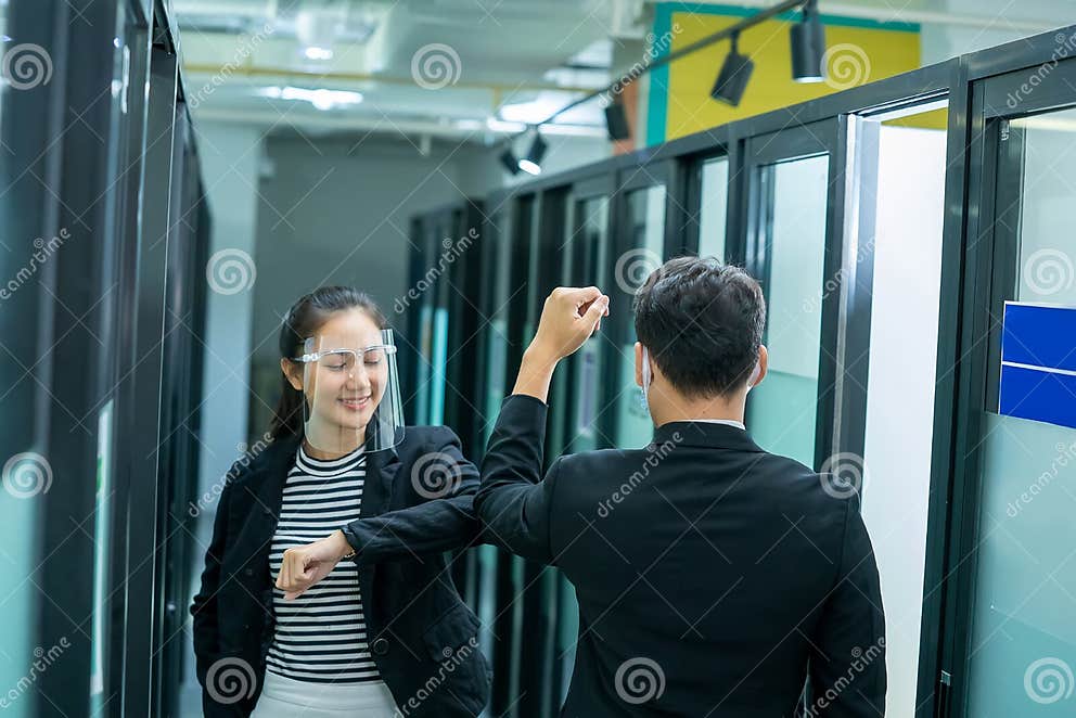 Woman and Man Colleagues Bumping Elbows,Avoid Handshaking Hugs while