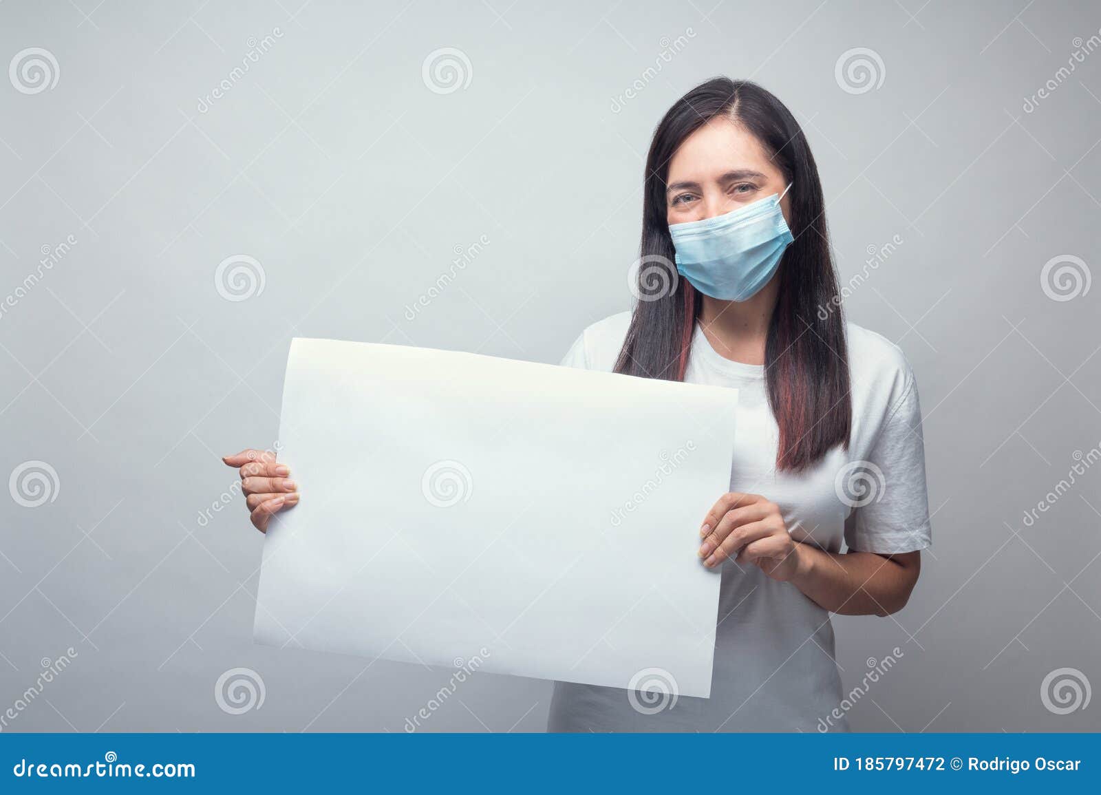 woman with mask and white sign