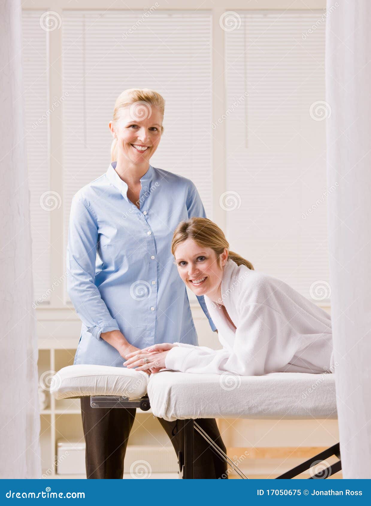 woman and massage therapist