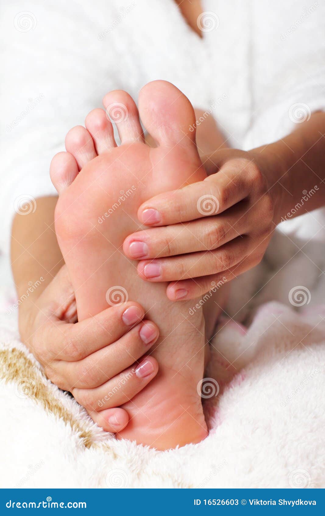 woman massaging his feet