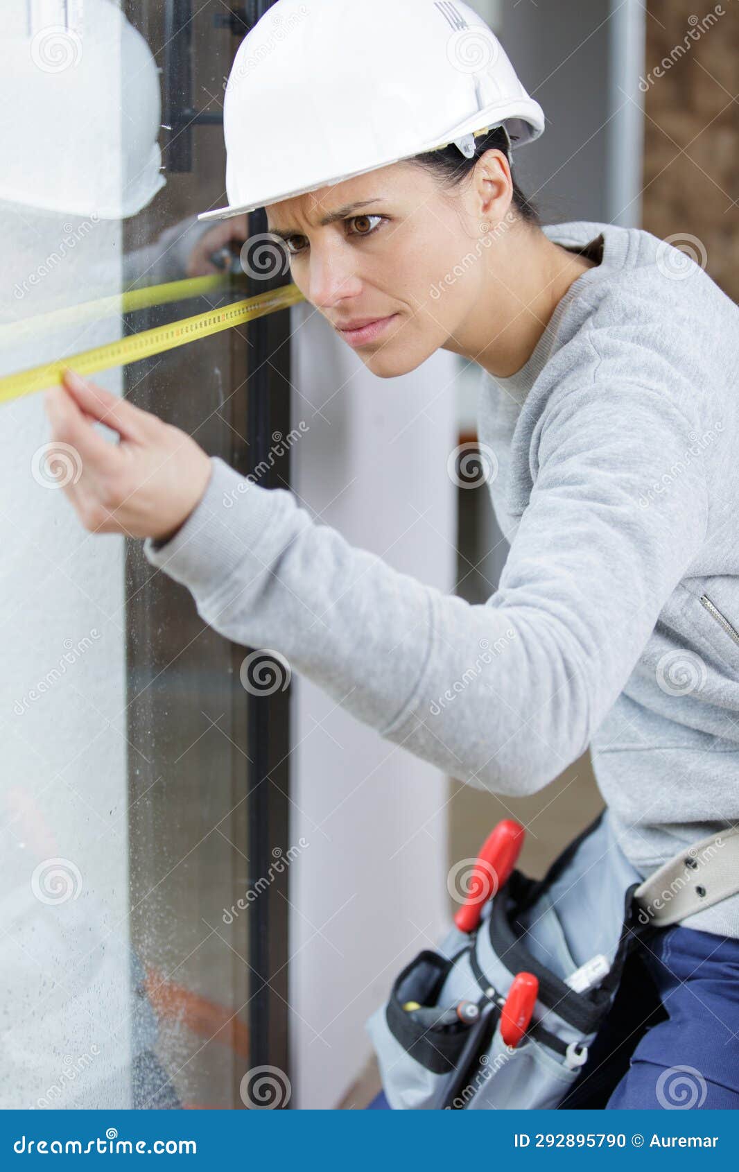 Woman with Measure Level Tool on Construction Site Stock Photo Image