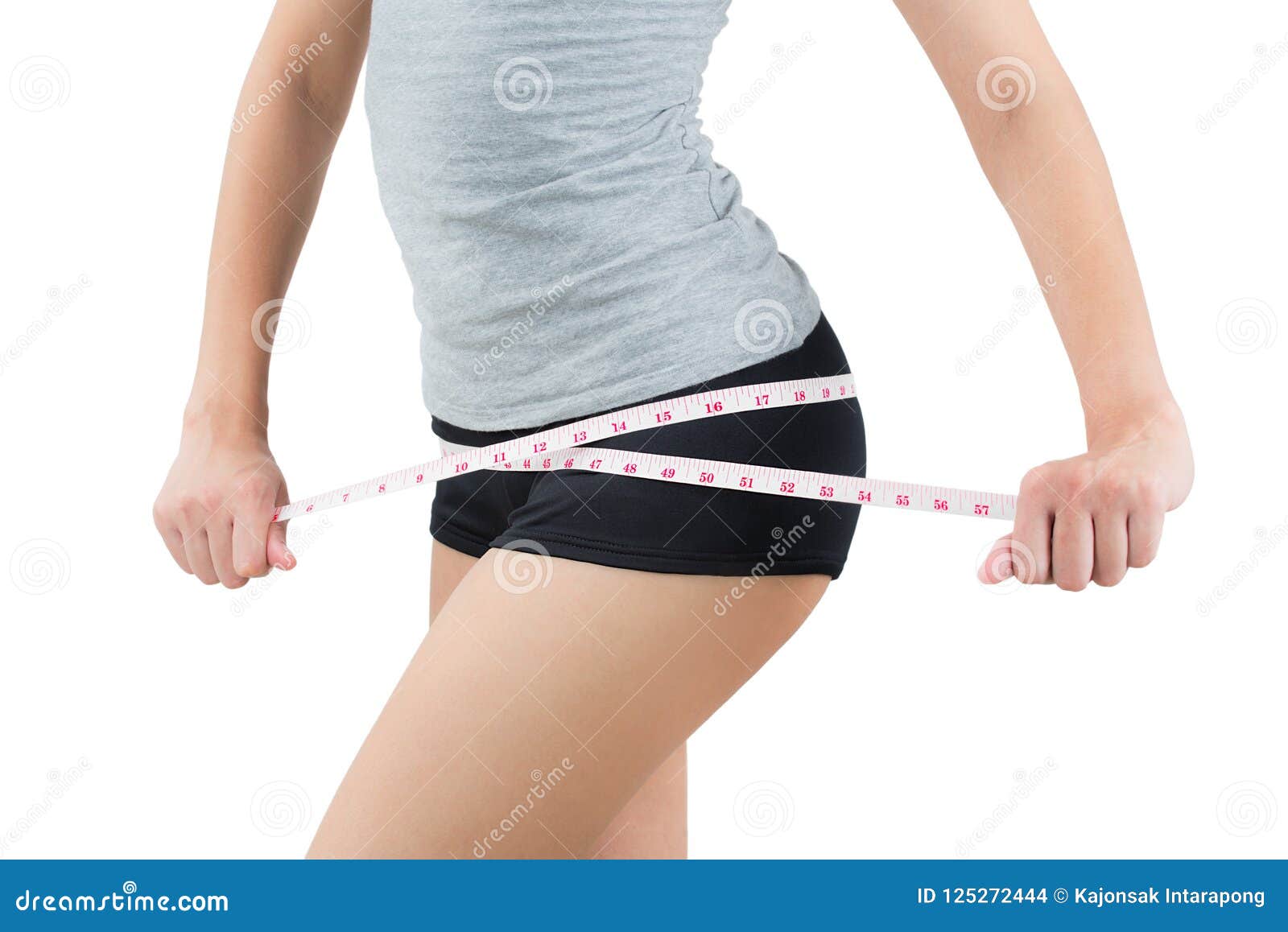 woman measuring her hip- lose weight and healthy body concept- o