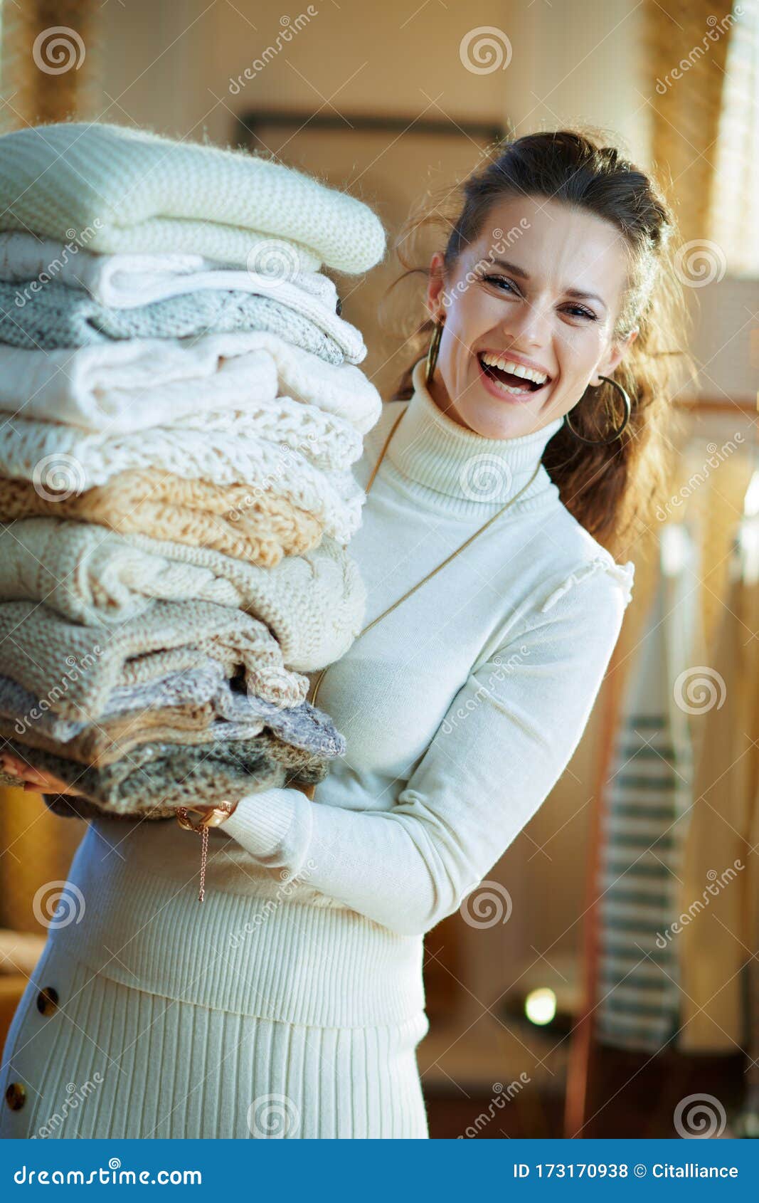 Woman in Modern House in Sunny Winter Day Holding Huge Sweaters Stock ...