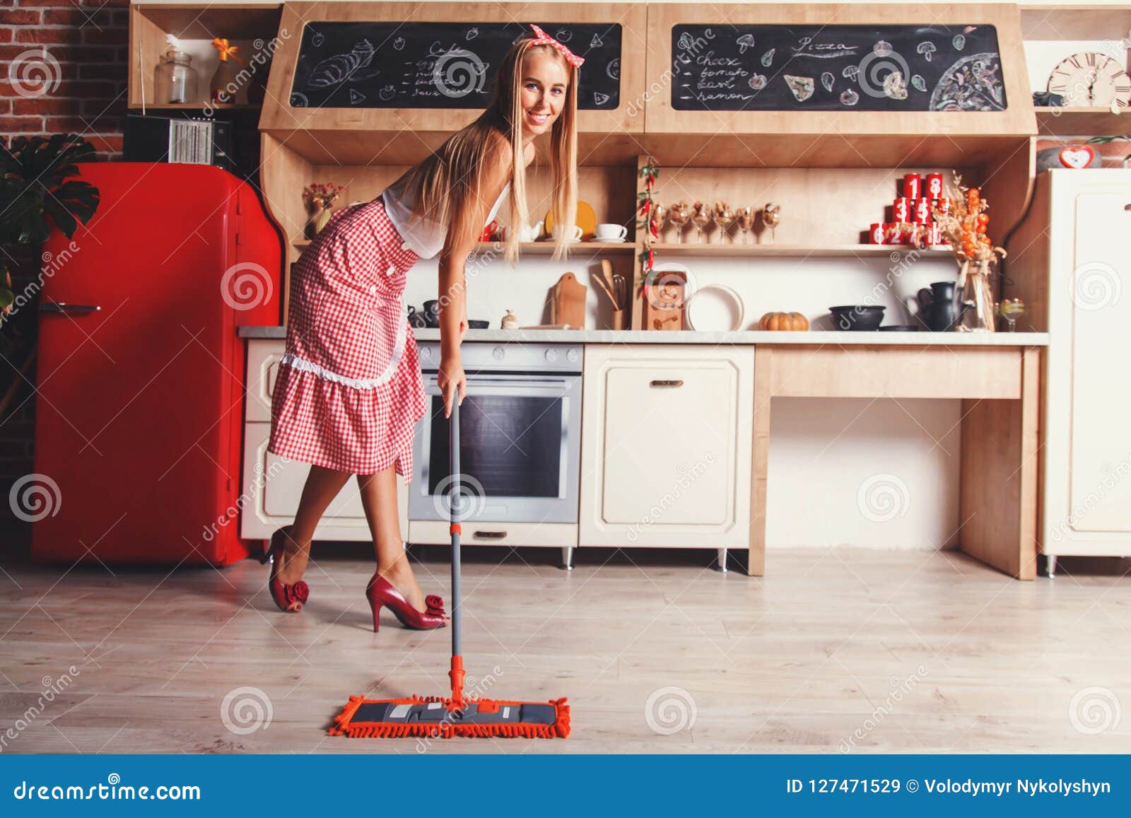 Woman is Moping the Floor stock image. Image of hairstyle 127471529