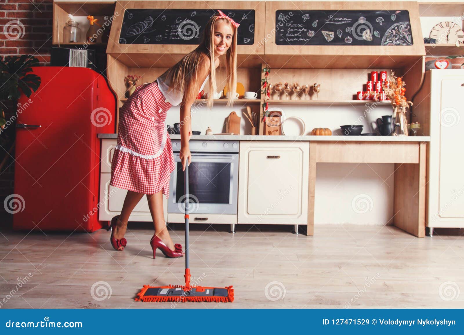 woman is moping the floor