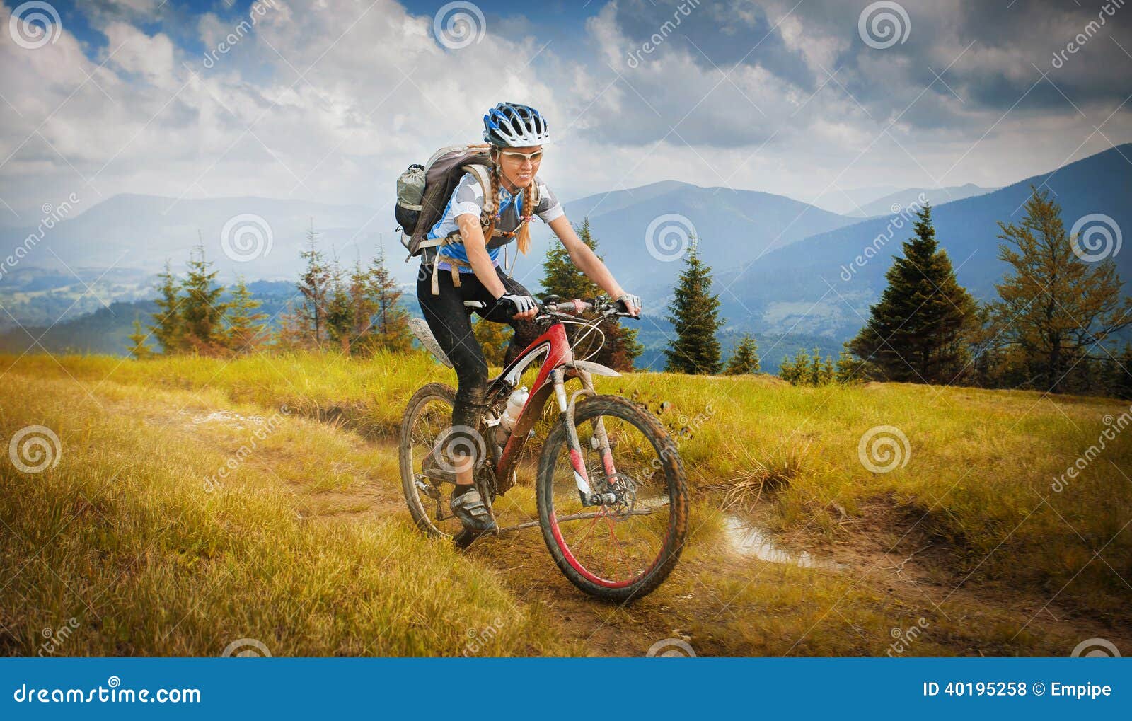 Cyclist In The Orange Jacket Riding The Bike On The Beautiful Summer ...