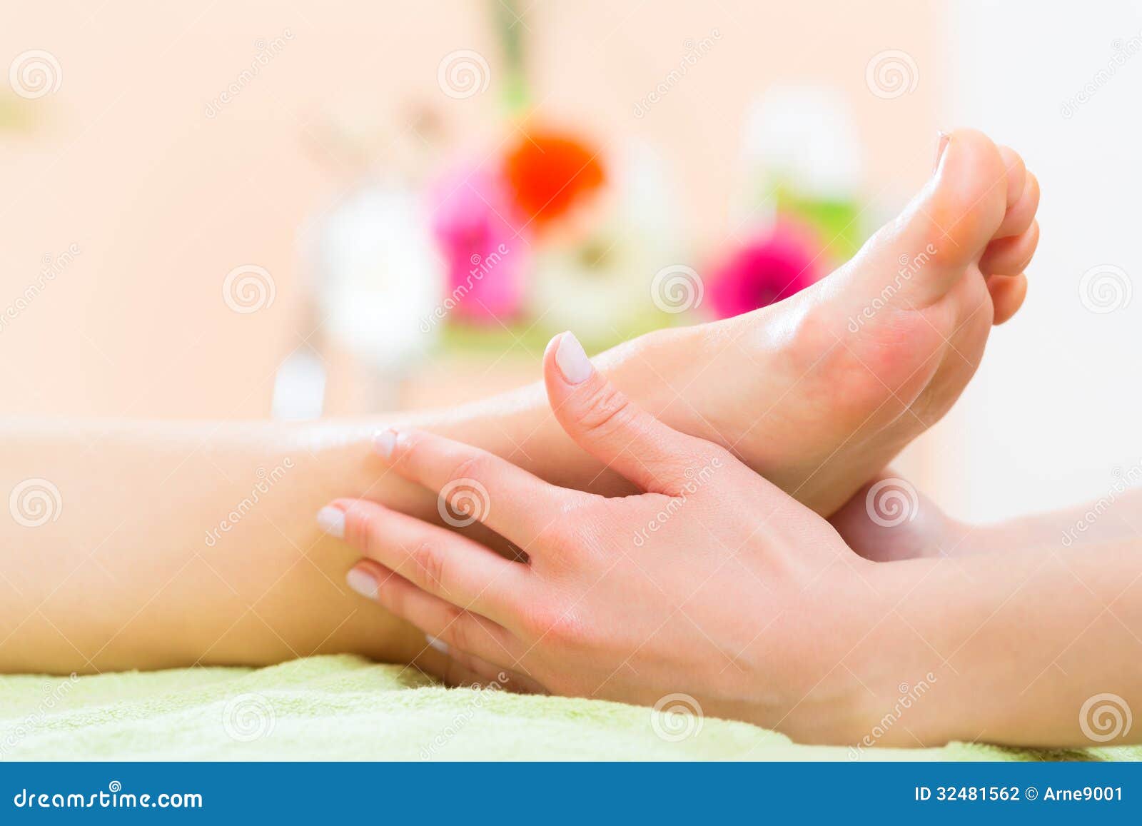 woman in nail salon receiving foot massage