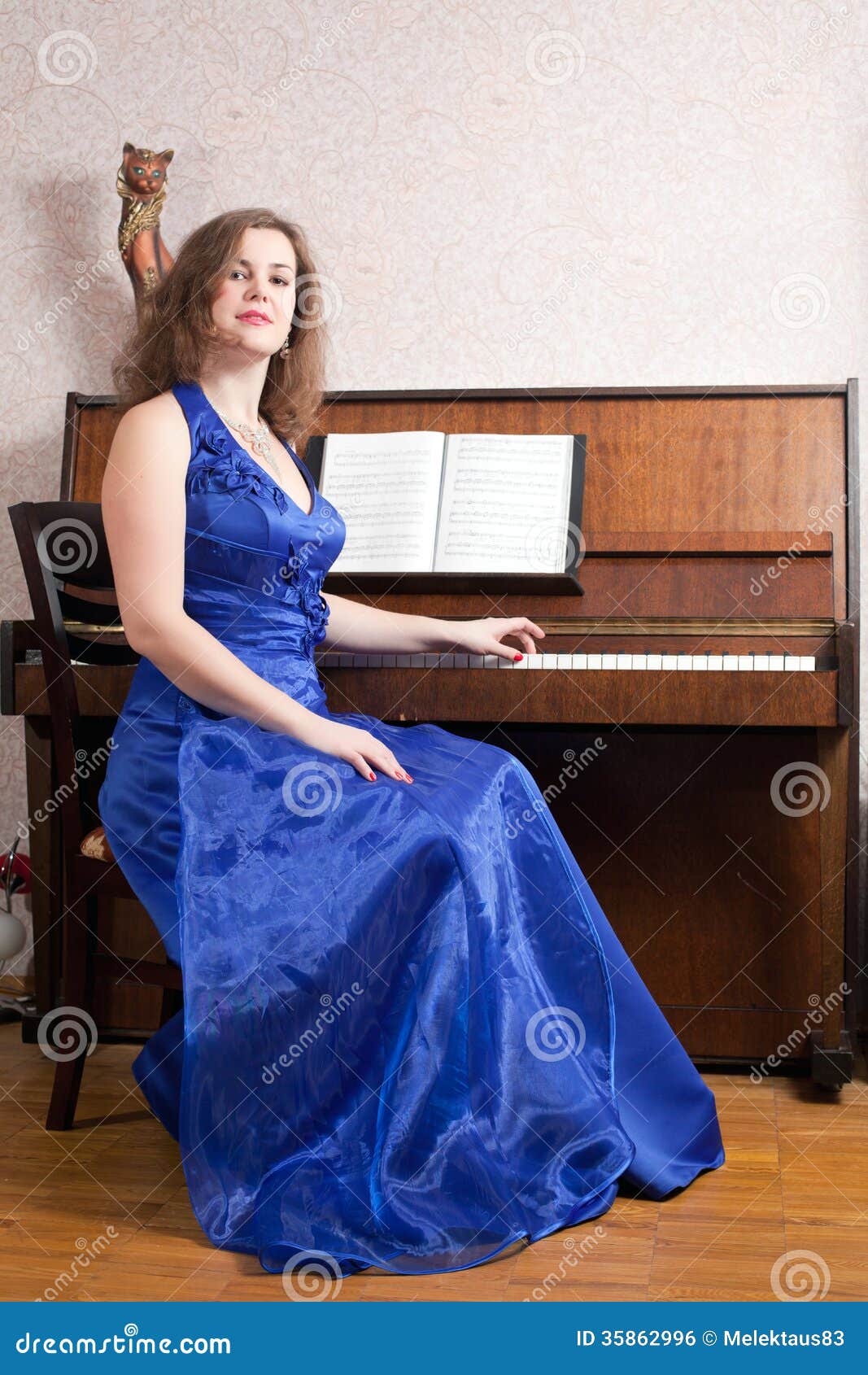 Woman near the piano stock photo. Image of sensuality ...