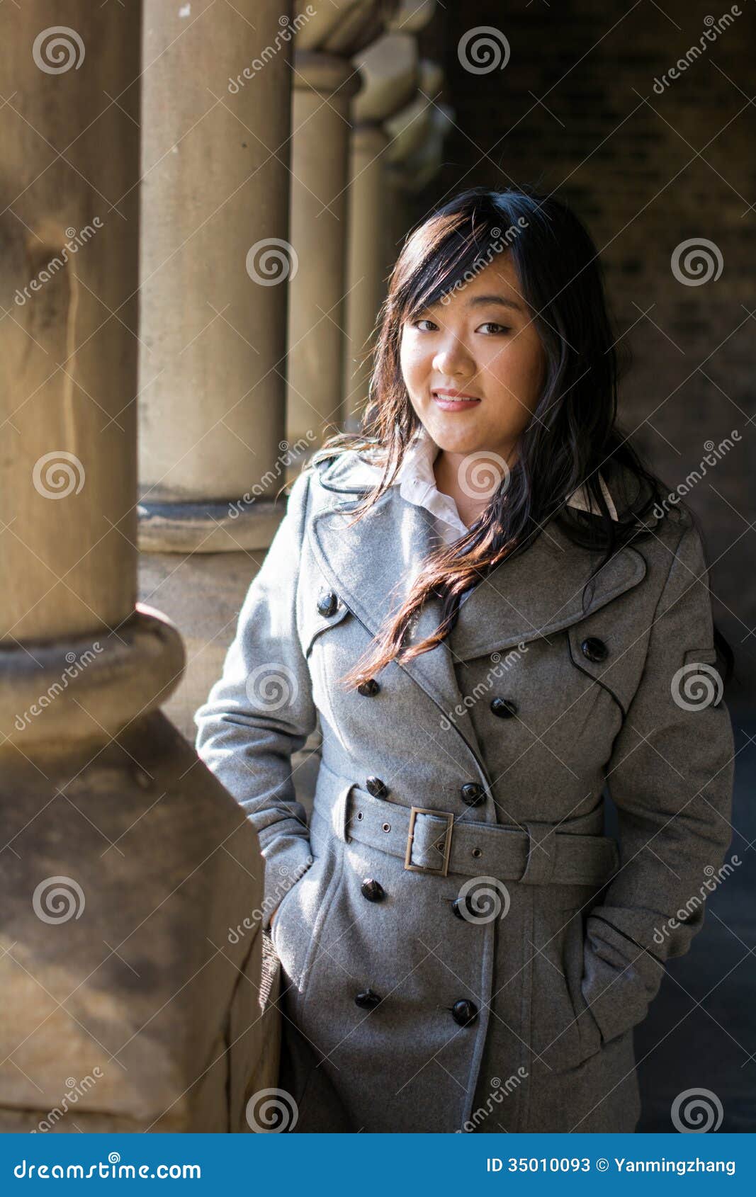 Woman near pillars stock image. Image of curly, emotional 35010093
