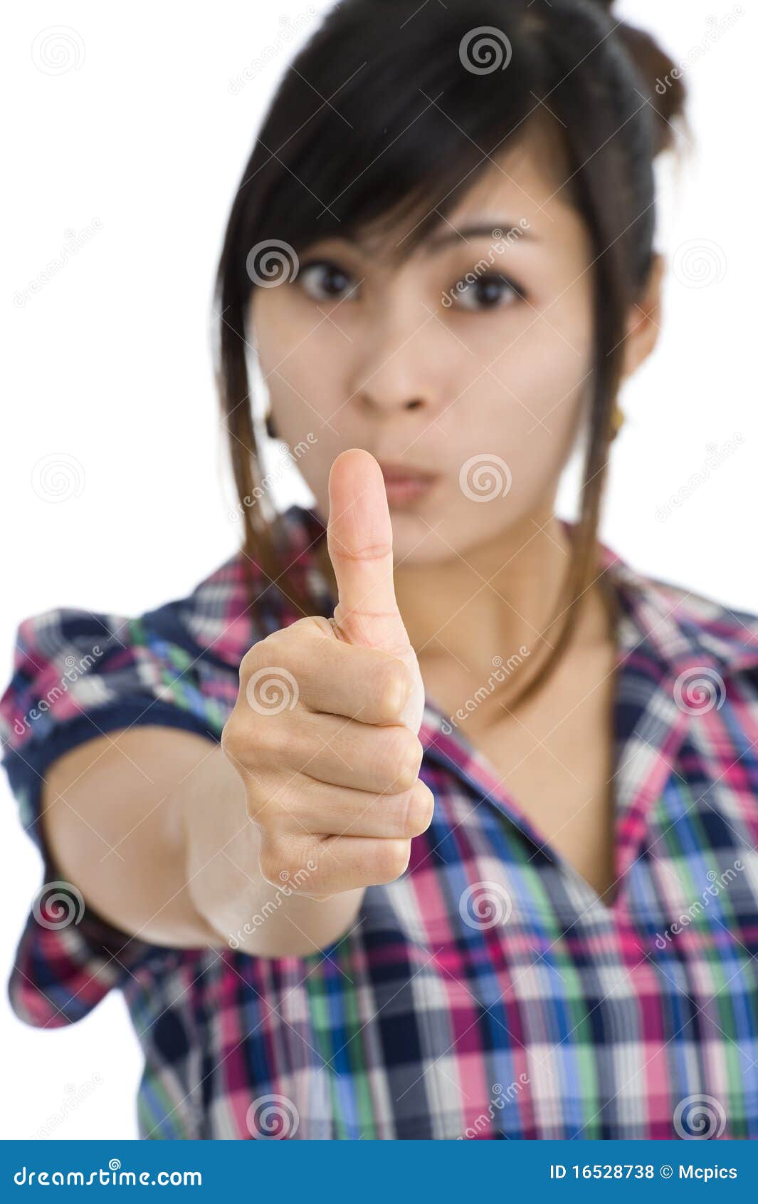 Woman with one thumb up. Beautiful woman shows one thumb up. focus on the thumbs with a shallow depth of field. isolated on white background.
