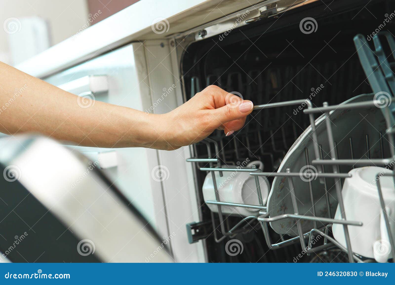 Dishwasher with a Plates, Cups and Other Dishware Stock Photo Image