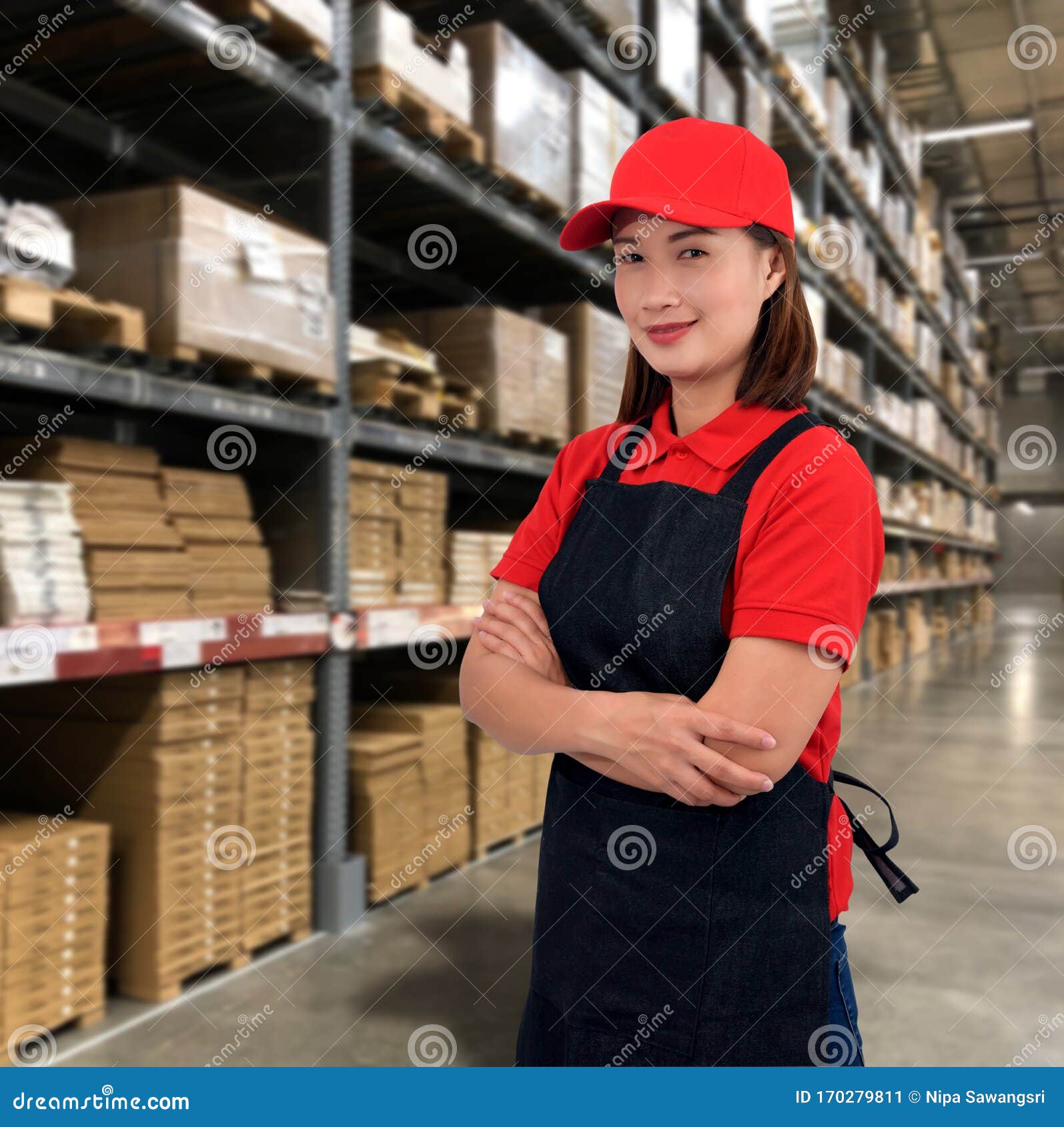 Woman Operator In Uniform With Blurred The Background Of The Warehouse