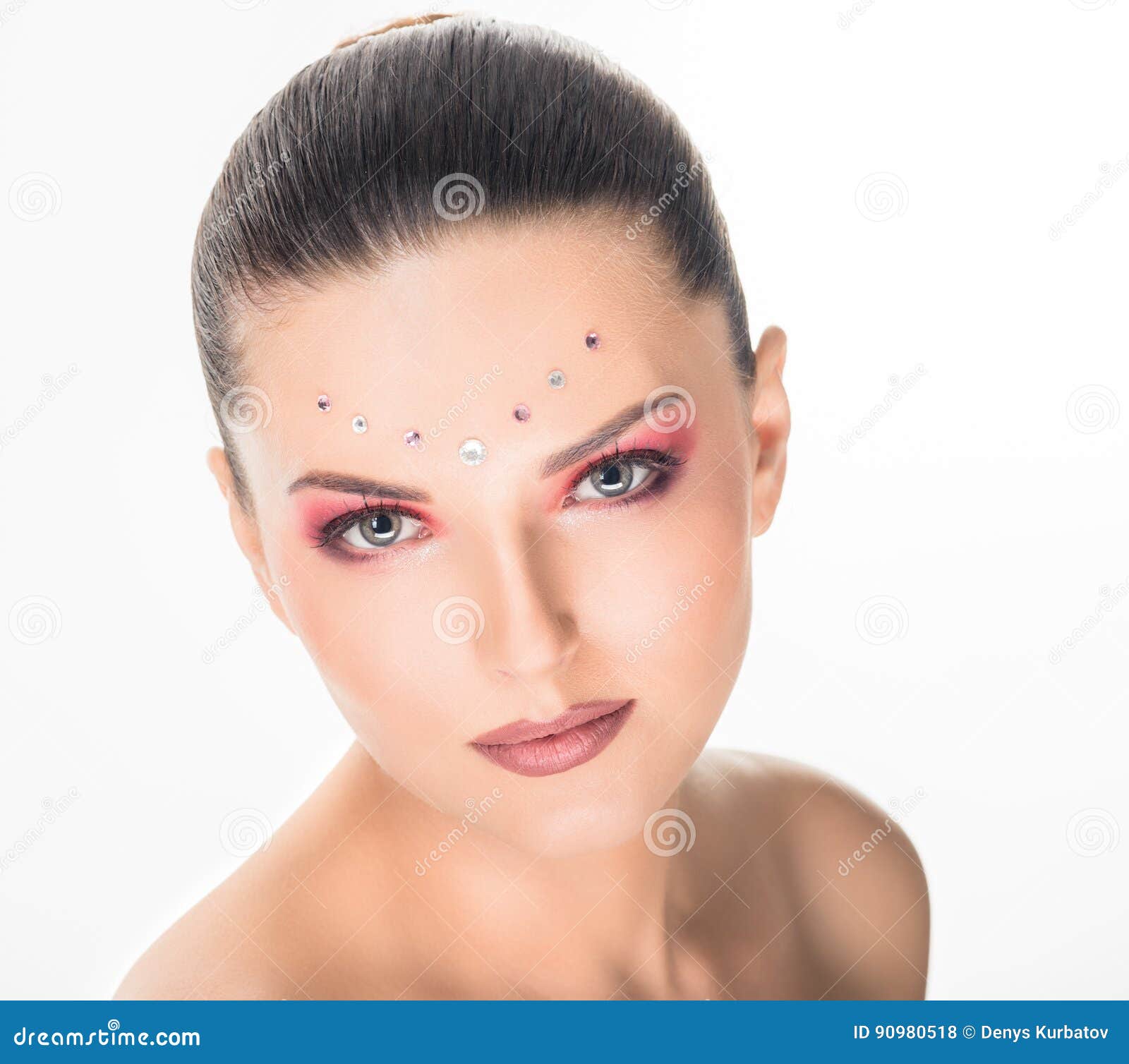 Woman with original make-up. Portrait of fashion beautiful young woman with crystals make-up