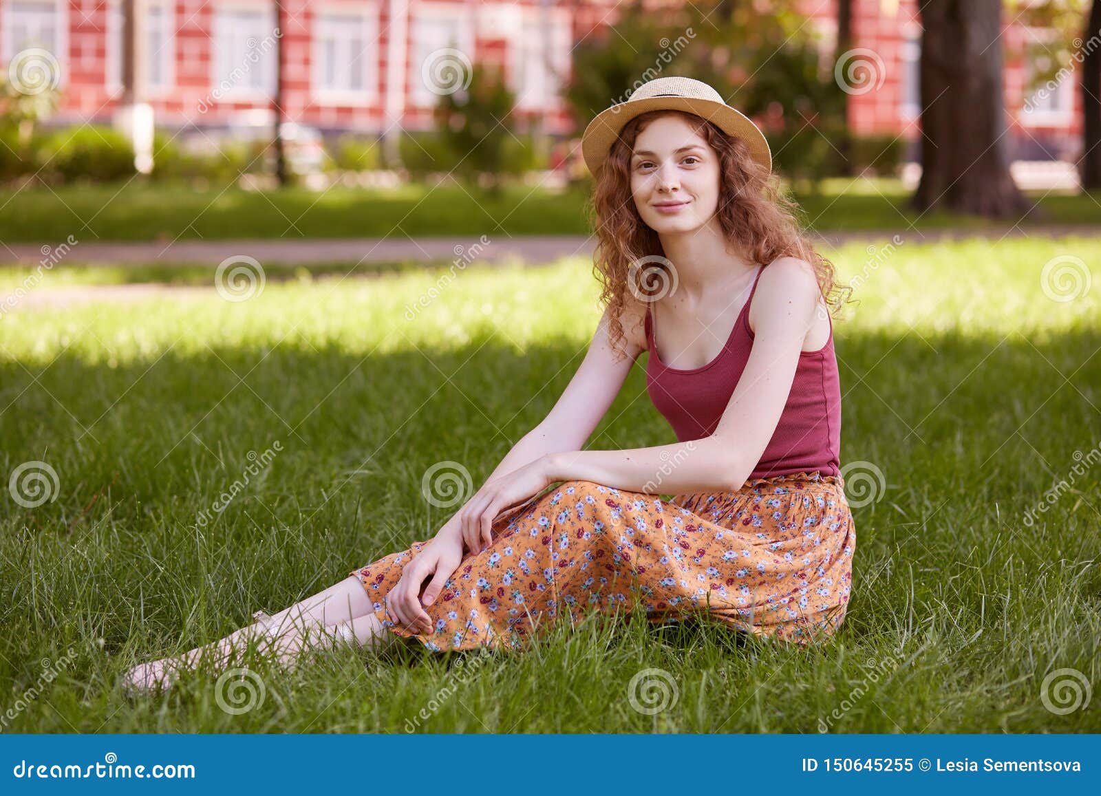 Adorable sport babe resting on the grass with sexy upskirt view