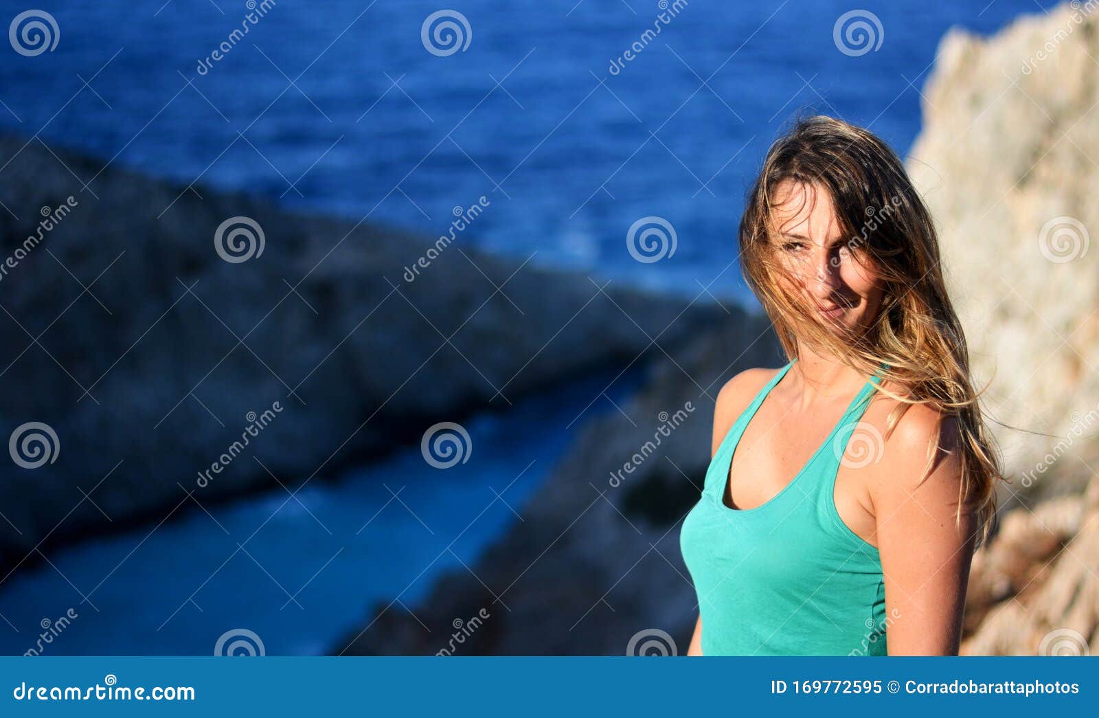 the woman over the big cliff on the atlantic