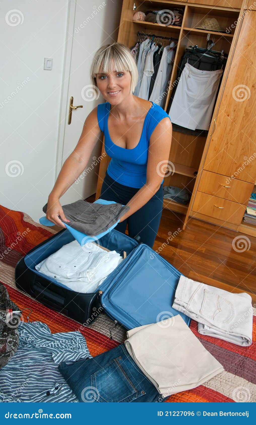 Woman packing clothes stock photo. Image of girl, interior - 21227096