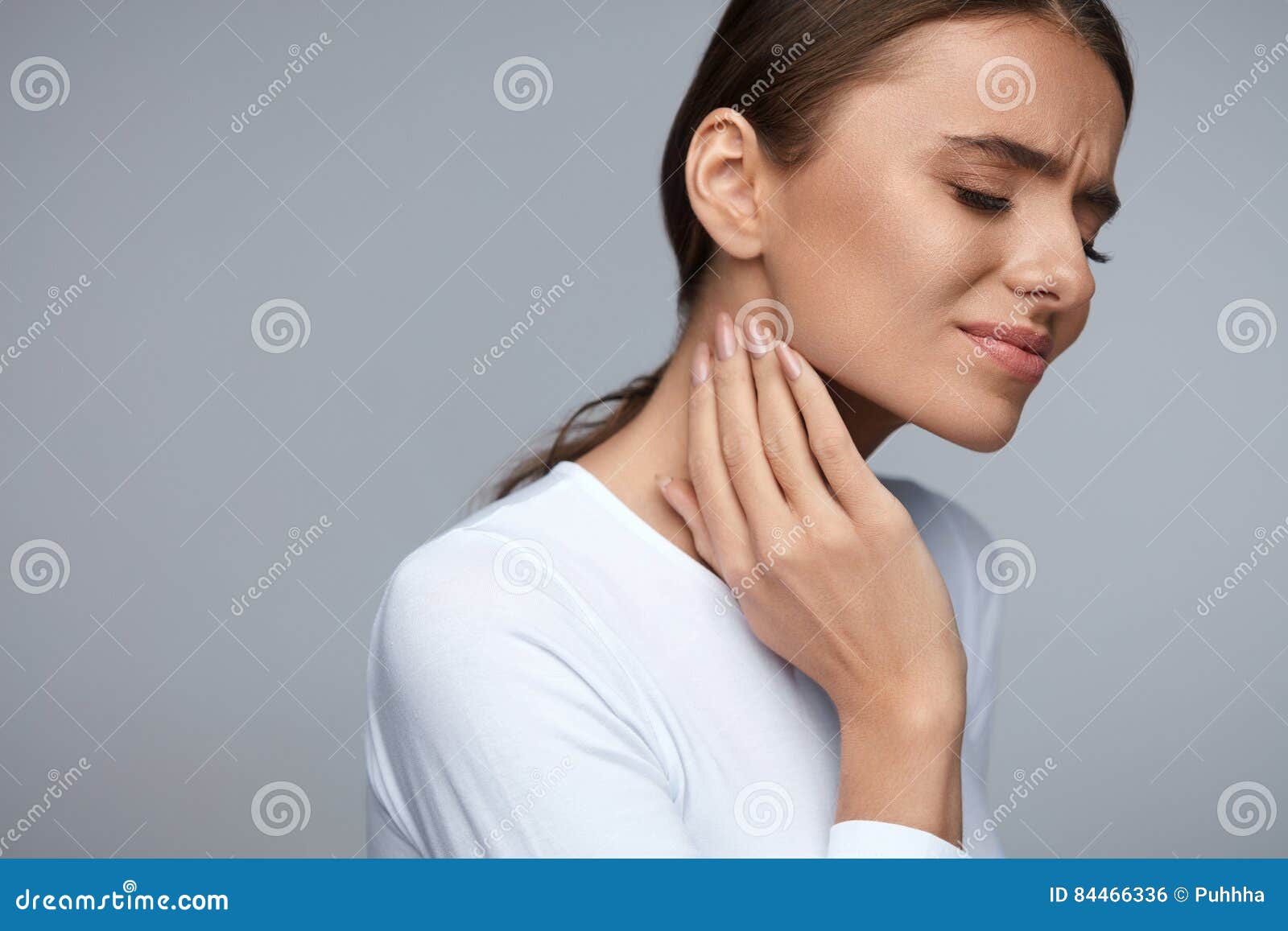 woman in pain. beautiful girl feeling toothache, jaw, neck pain