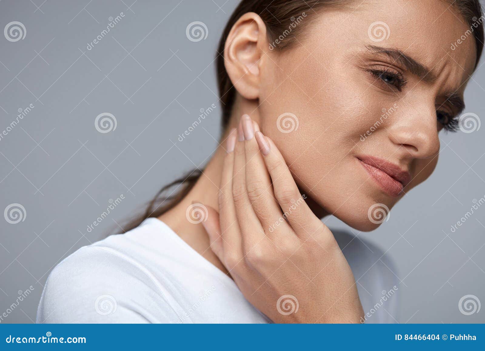 woman in pain. beautiful girl feeling toothache, jaw, neck pain