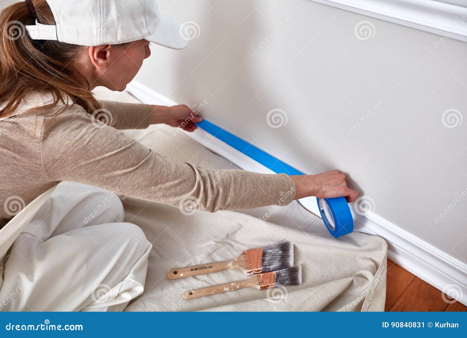 woman painting wall