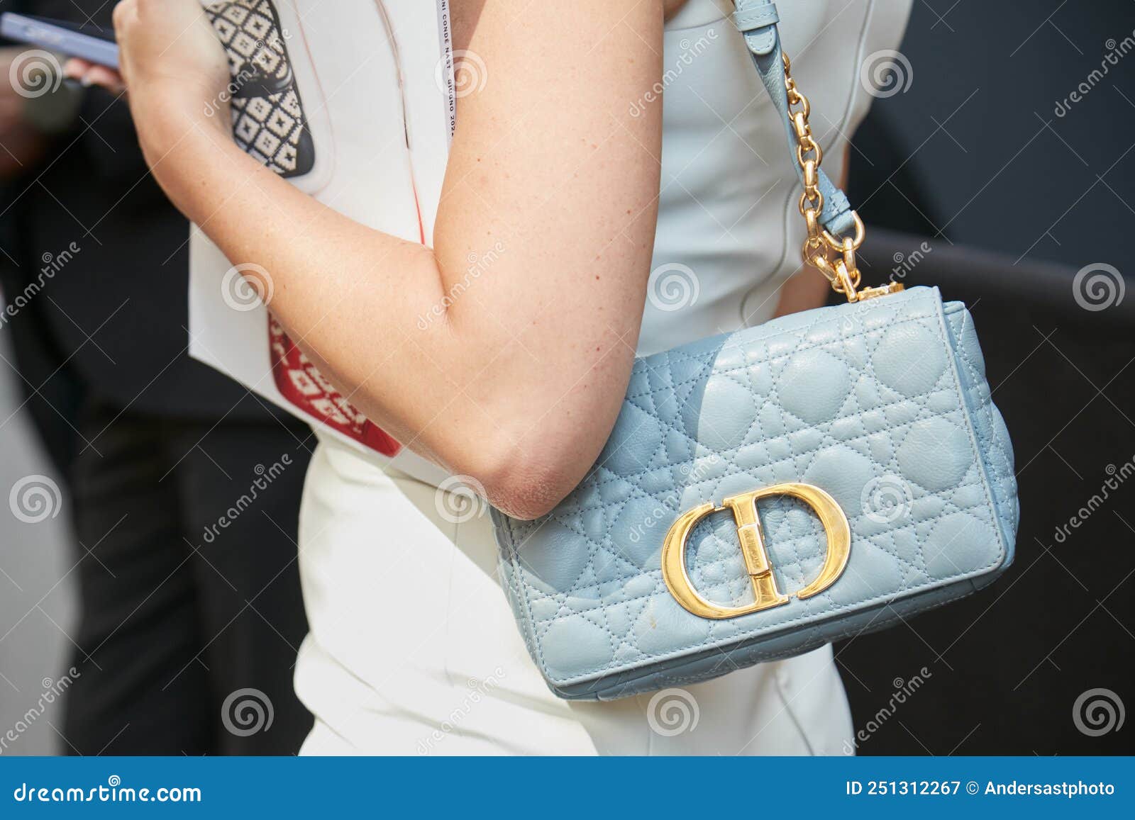 Woman with Louis Vuitton Bag with Golden Chain and White Jacket before  Emporio Armani Fashion Editorial Image - Image of golden, chain: 194222960