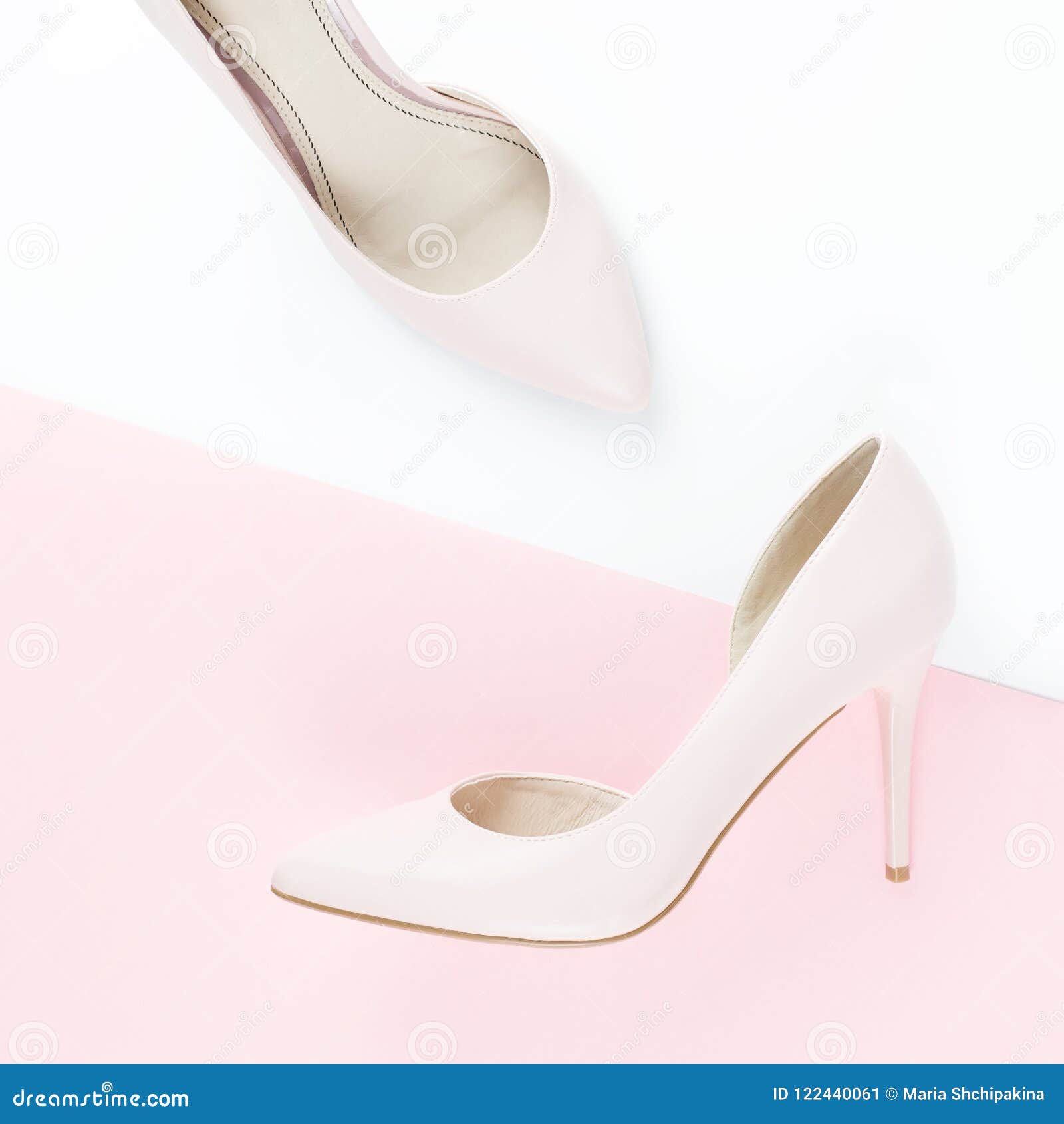 Woman Pale Pink Pumps On Pink And White 