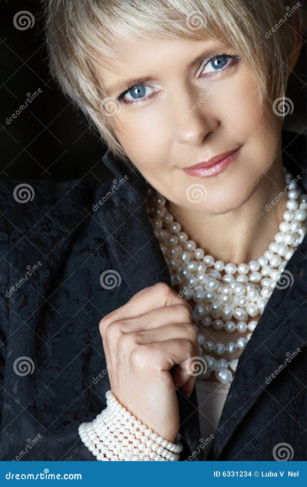 woman in pearls in her 40s