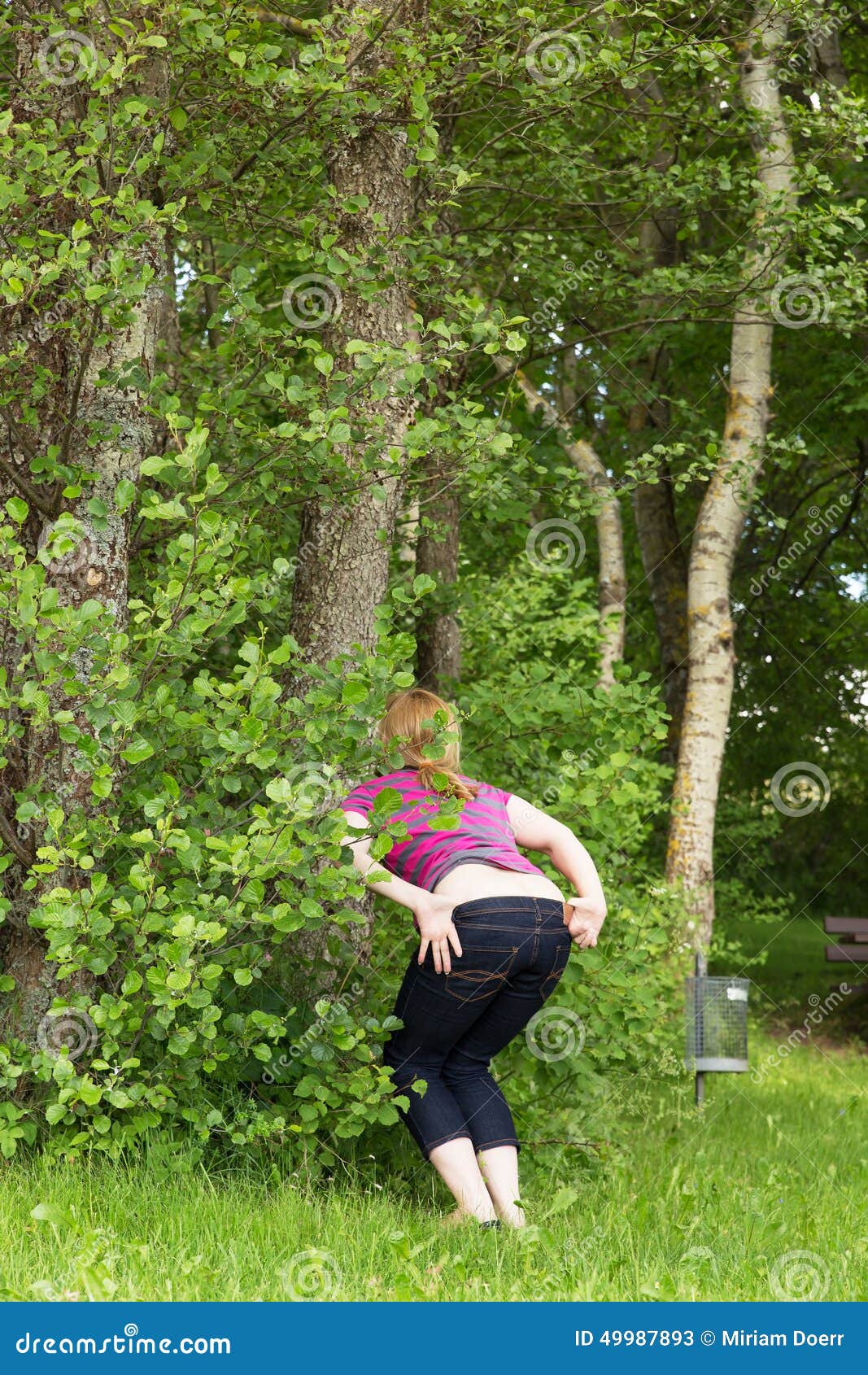 Woman Is Peeing In The Nature Stock I