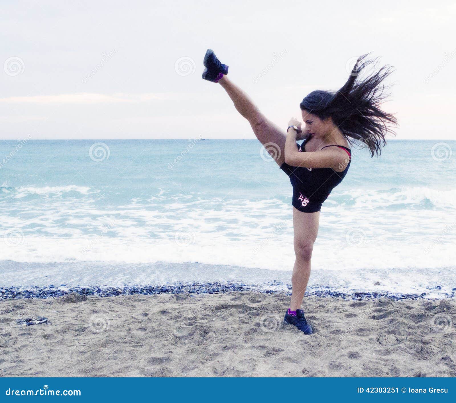 woman performing a high kick
