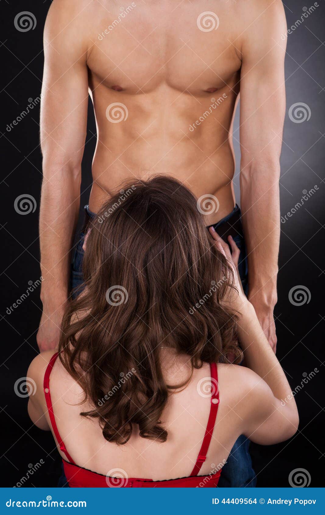 Woman Performing Oral Sex with Man Stock Photo pic