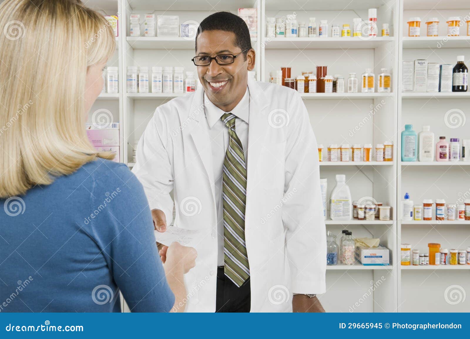 woman picking up prescription drugs at pharmacy