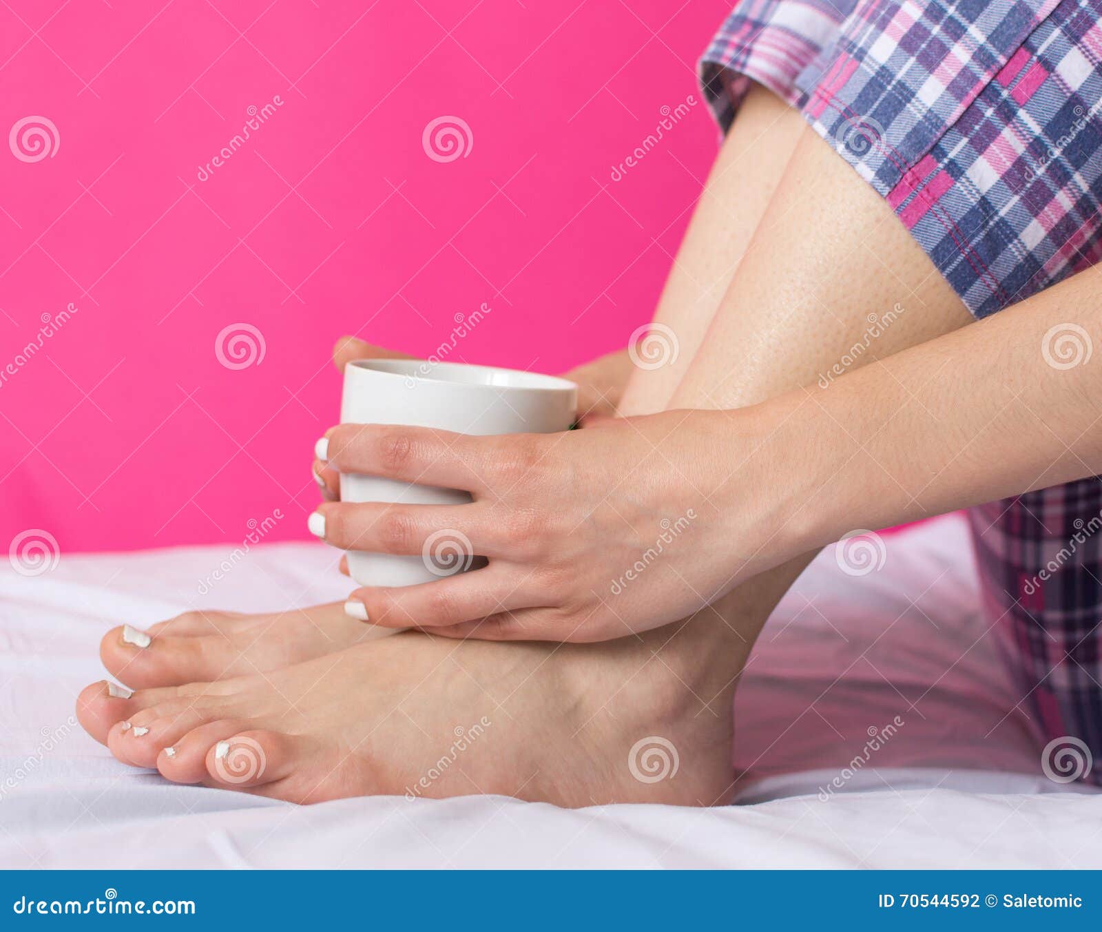 woman in pijama having cup of coffee